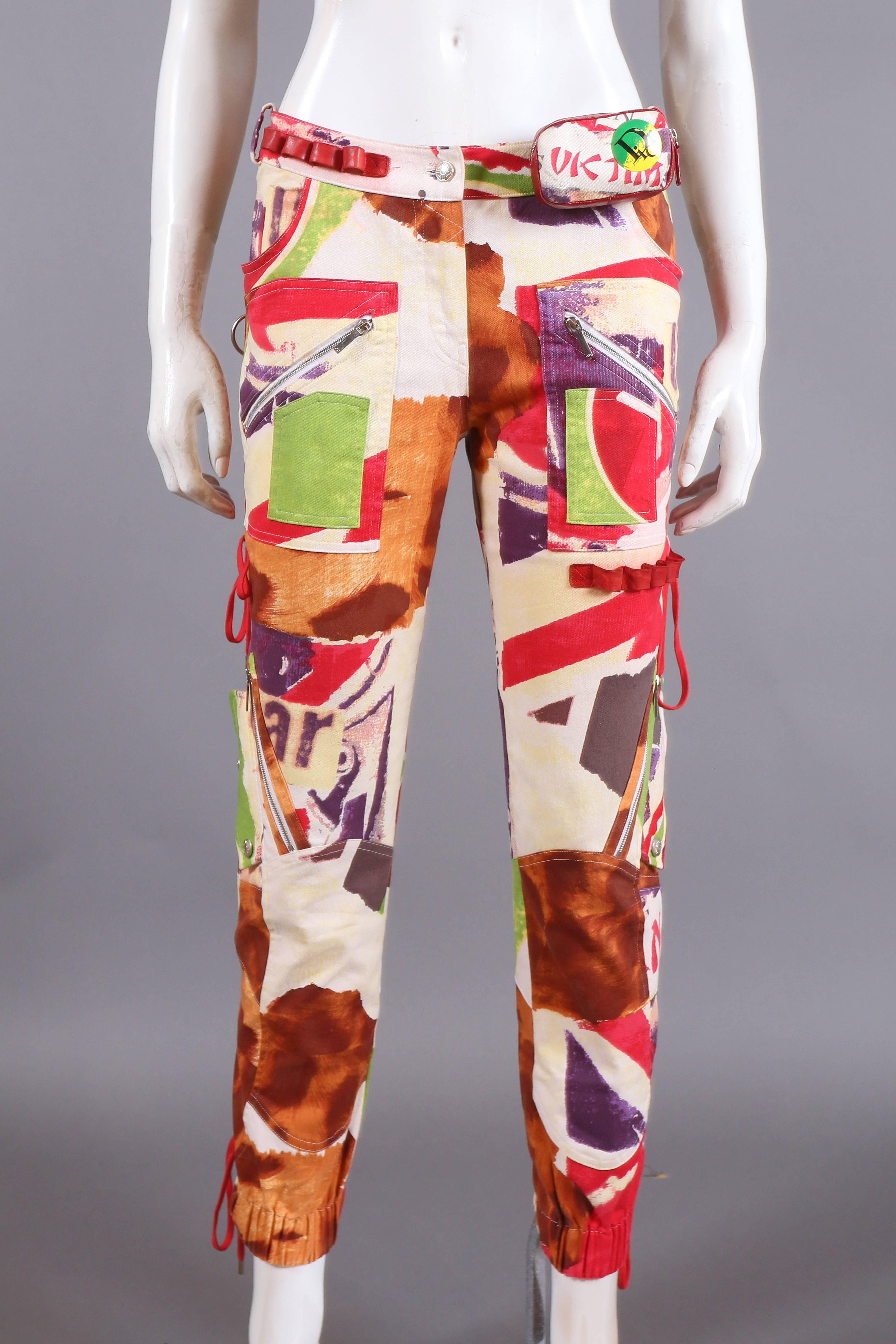 John Galliano for Christian Dior graffiti print cropped pants, spring-summer 2003. The pants features elasticated ankle cuffs, detachable leather pouch on waist, decorative lace up fastenings and multiple zippered pockets. 

 