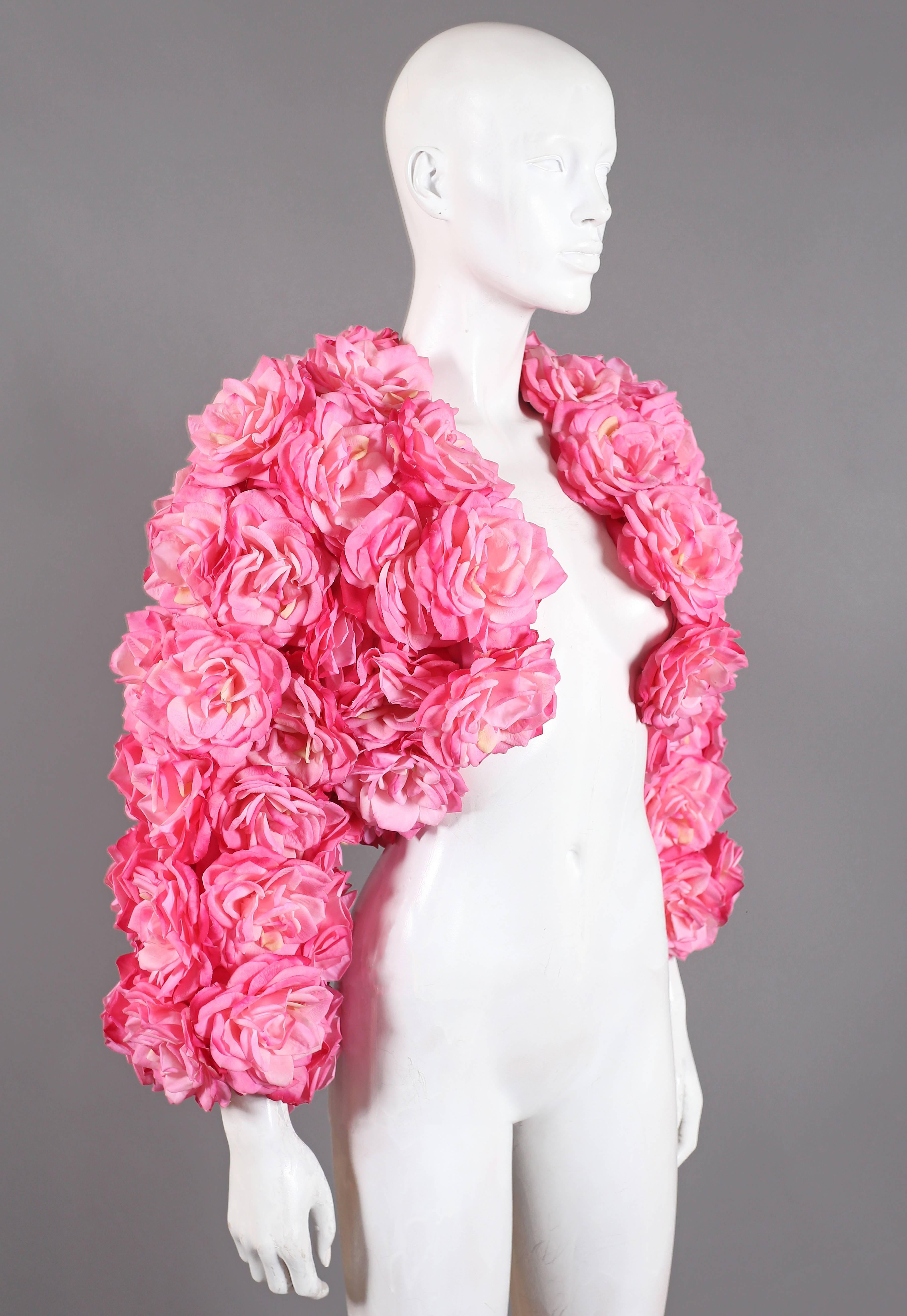Out of this world oversized bolero jacket by Rachel London. The jacket is adorned in beautiful high quality real touch pink roses which look and feel like real petals! Madonna chose to wear the same design at the Tony Awards in 1988.

Size Small