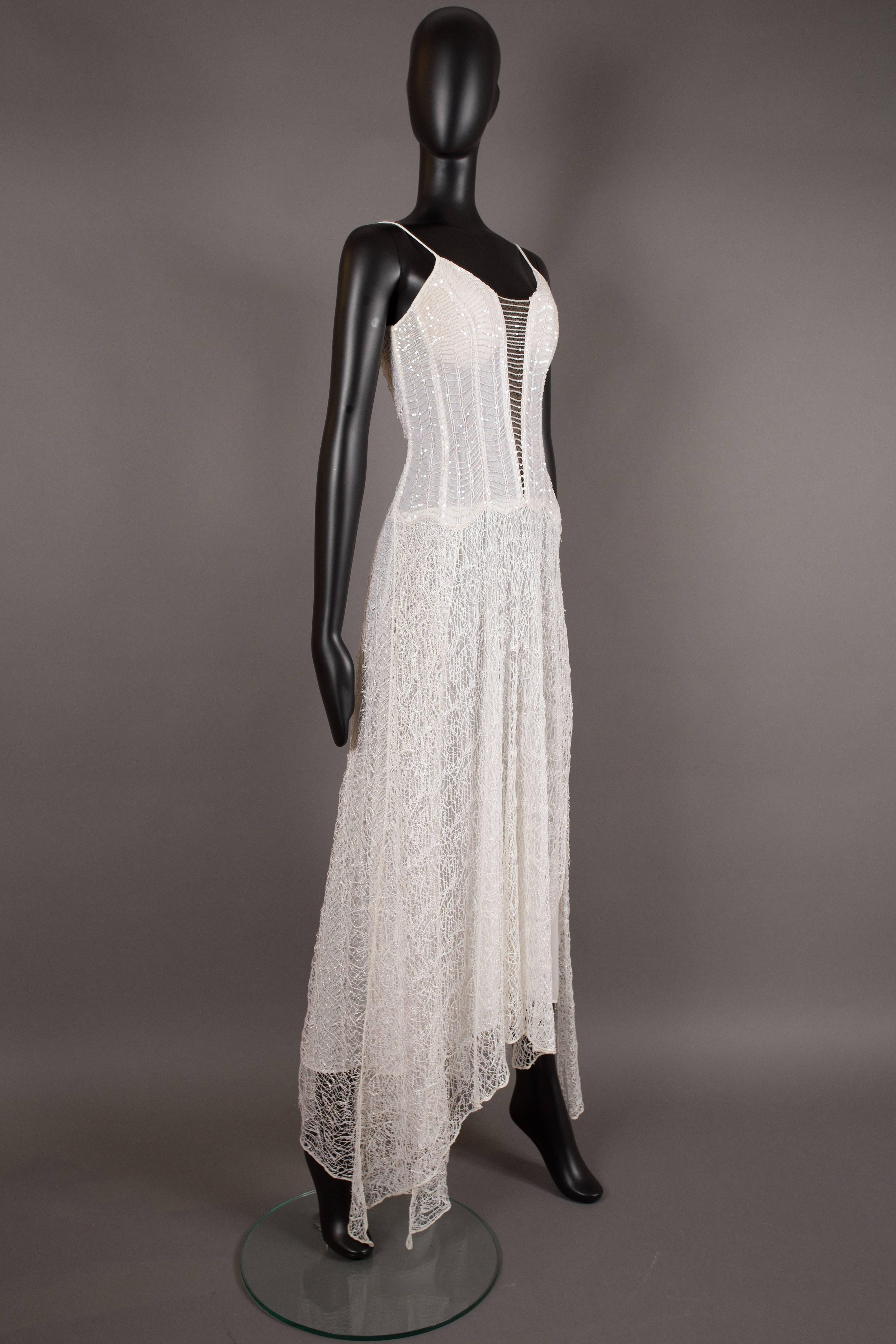 A La Perla evening dress, circa 1990s. Boned and sequinned bodice, interior bra, white and metallic silver web lace overlay, white interior slip and invisible zip closure at rear. 


