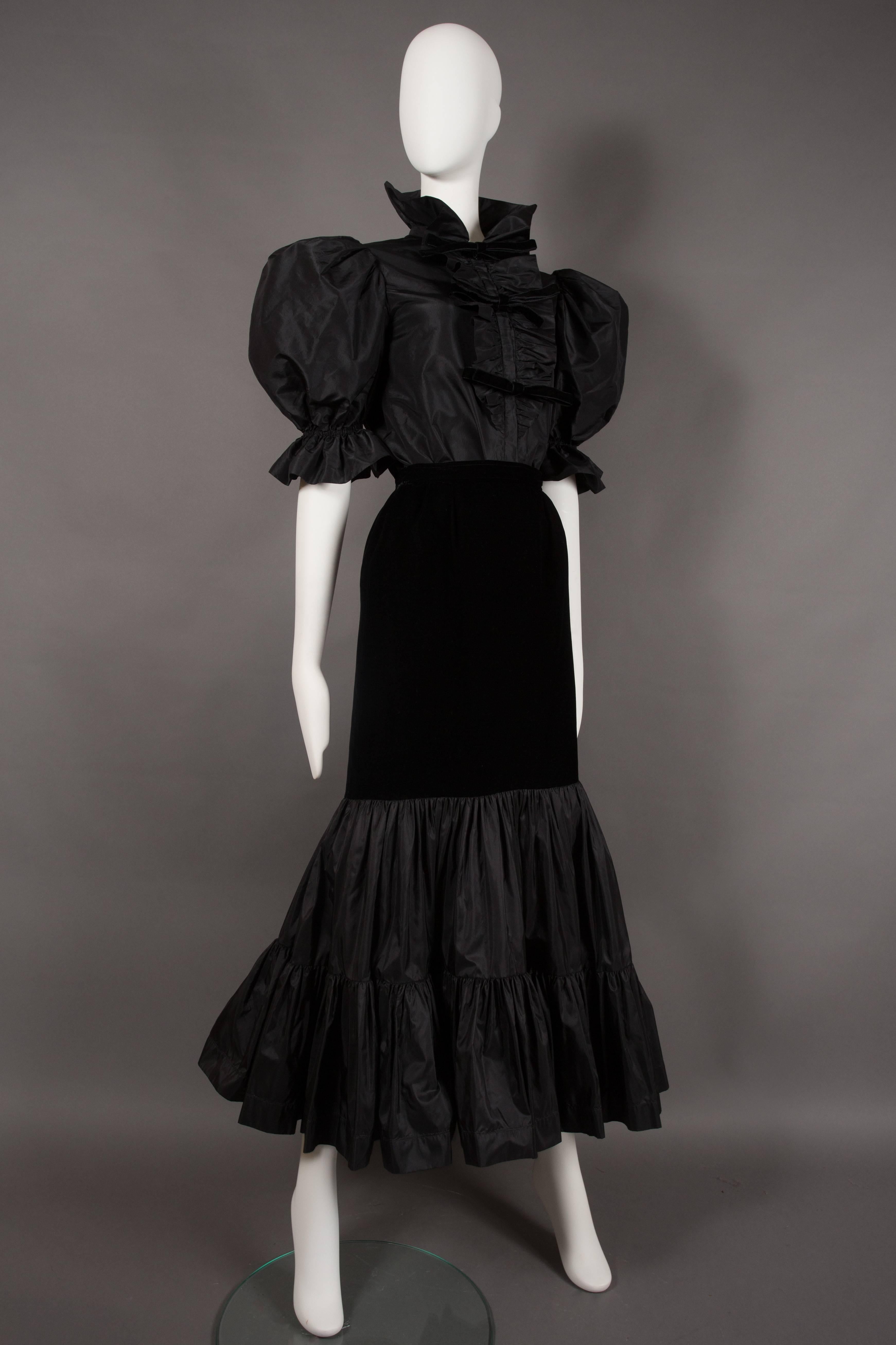 Presenting an exceptionally rare Yves Saint Laurent black silk taffeta and velvet evening ensemble, a true treasure from the esteemed designer's collection circa 1977-78. This exquisite ensemble exudes timeless elegance and is a testament to Yves