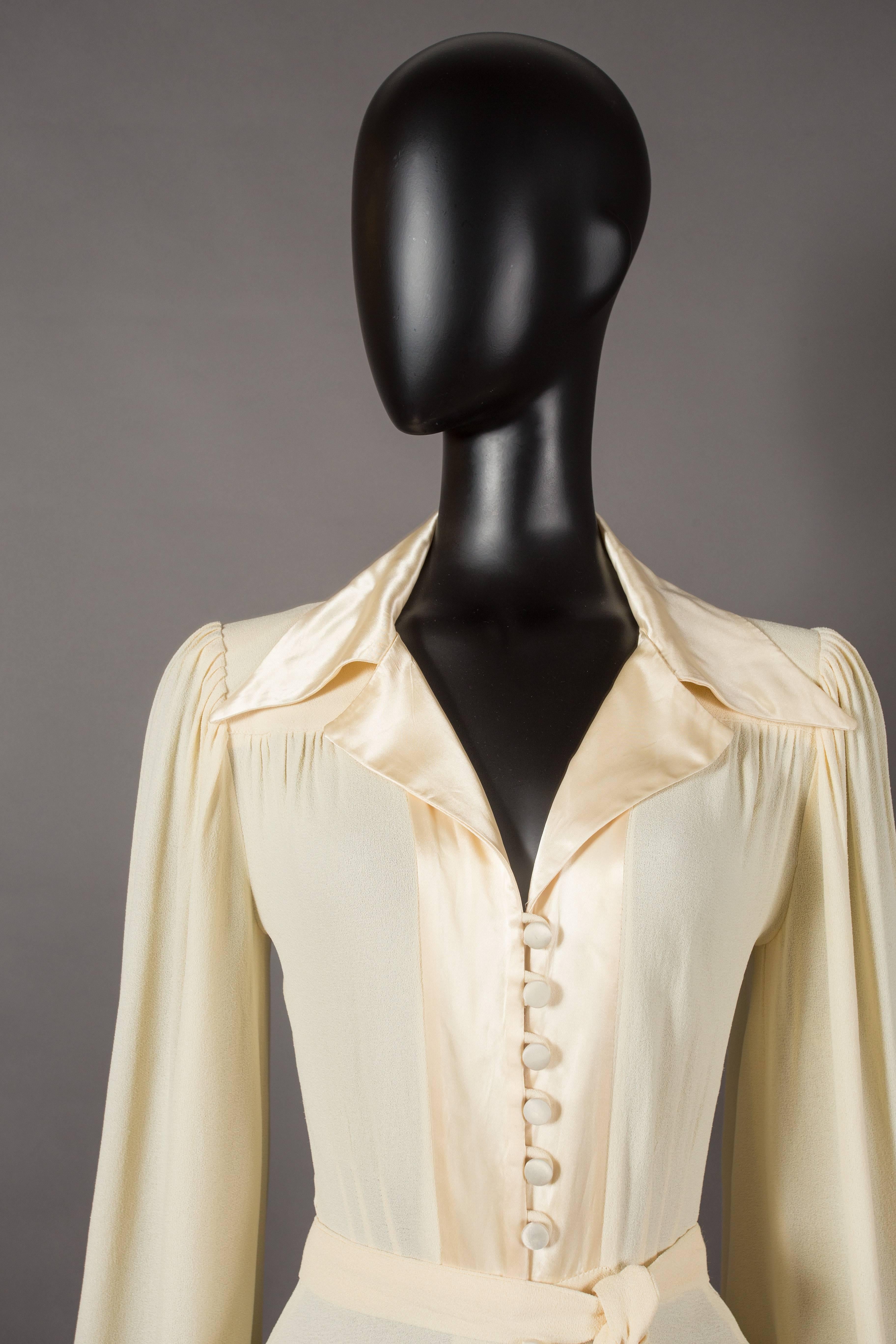 Beige Ossie Clark ivory moss crepe collared evening dress with satin trim, circa 1974