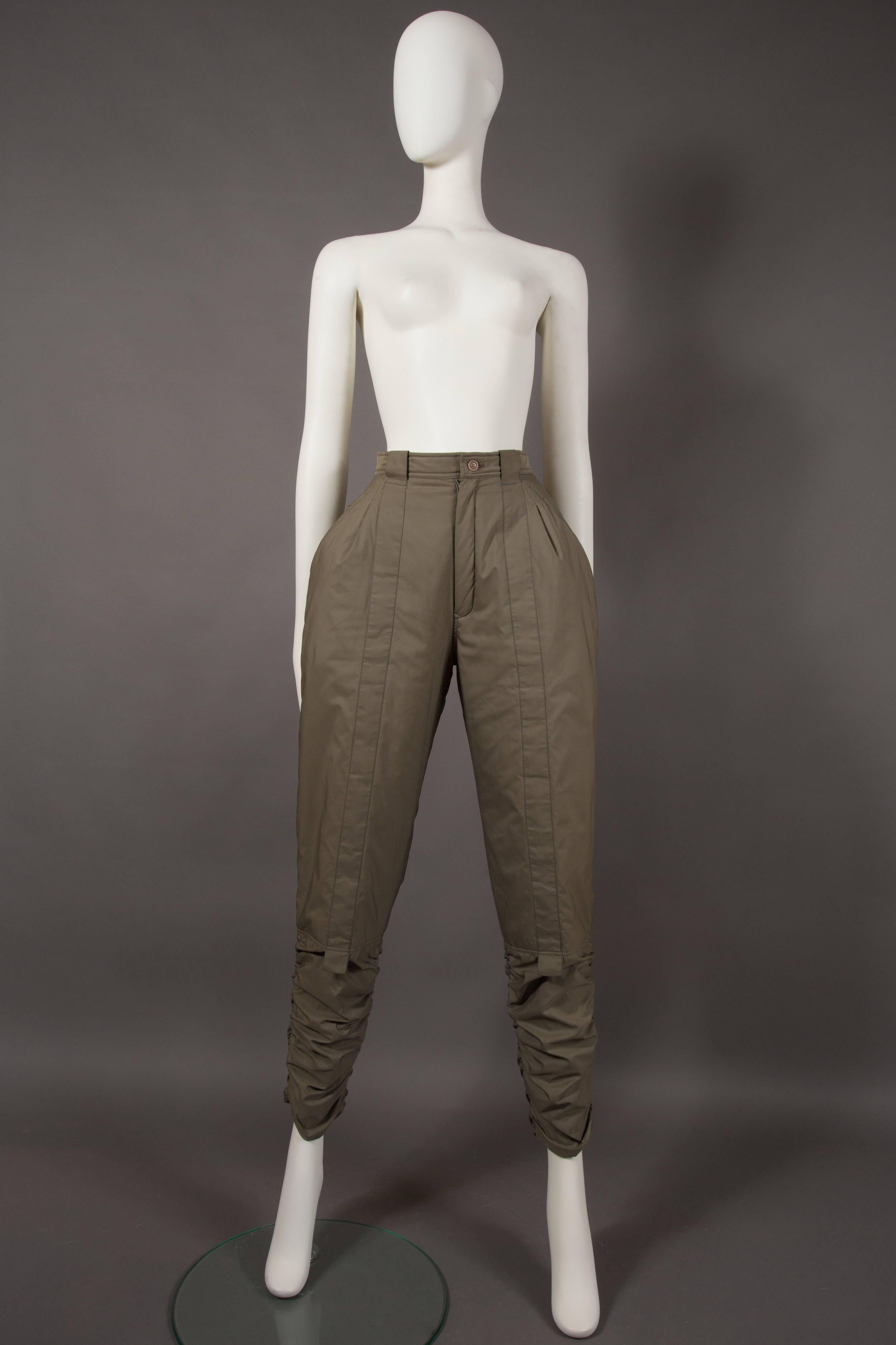 A rare pair of Issey Miyake sports pants, autumn-winter 1983. Ruching on the ankles, high waisted, accentuated hips, two front pockets, two back pockets and zip closure. 