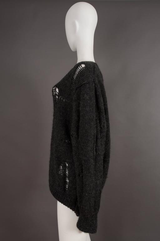 Comme des Garcons oversized sweater decorated with holes, circa