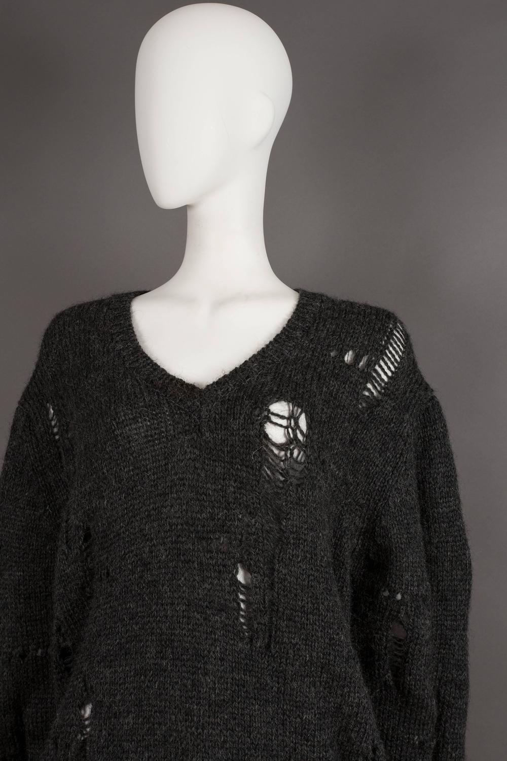 oversized sweater decorated with holes 