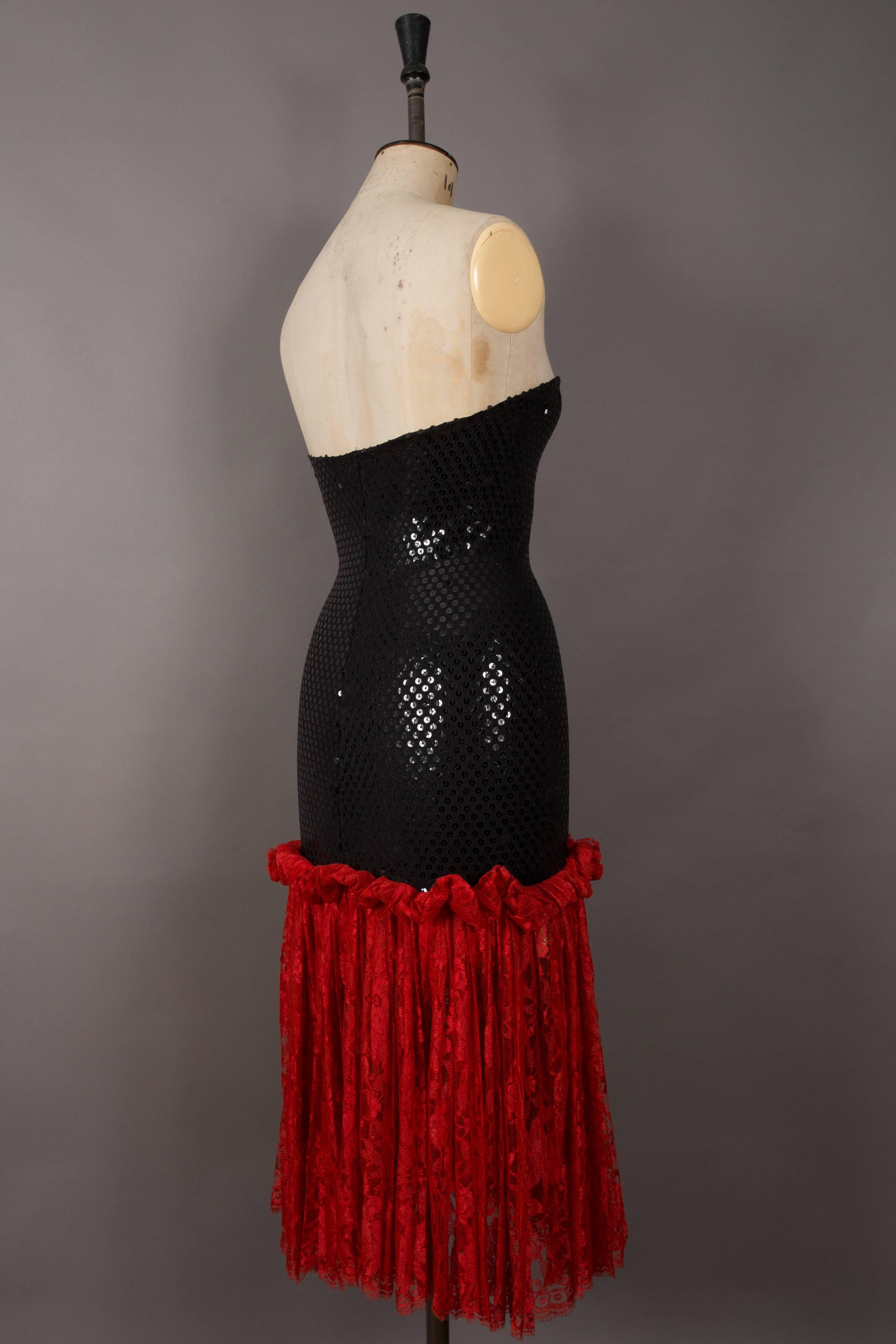 Black Bastet strapless sequin cocktail dress with red lace skirt, circa late 1970s