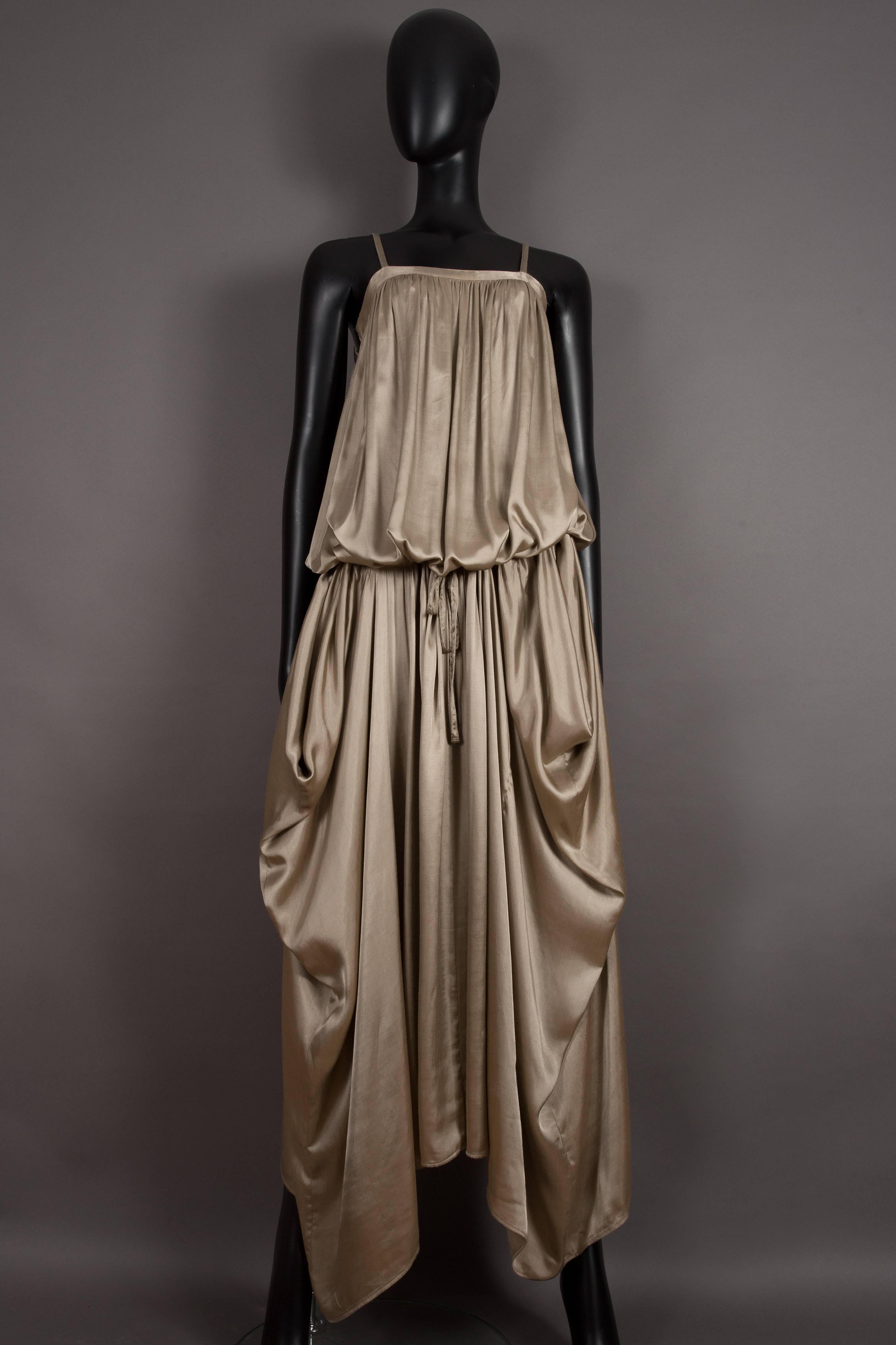Rare Kenzo Jap taupe viscose evening dress, circa 1977. The dress features masses of pleated fabric, spaghetti straps, two hidden side pockets and an adjustable drawstring waist which can be styled in numerous ways. 