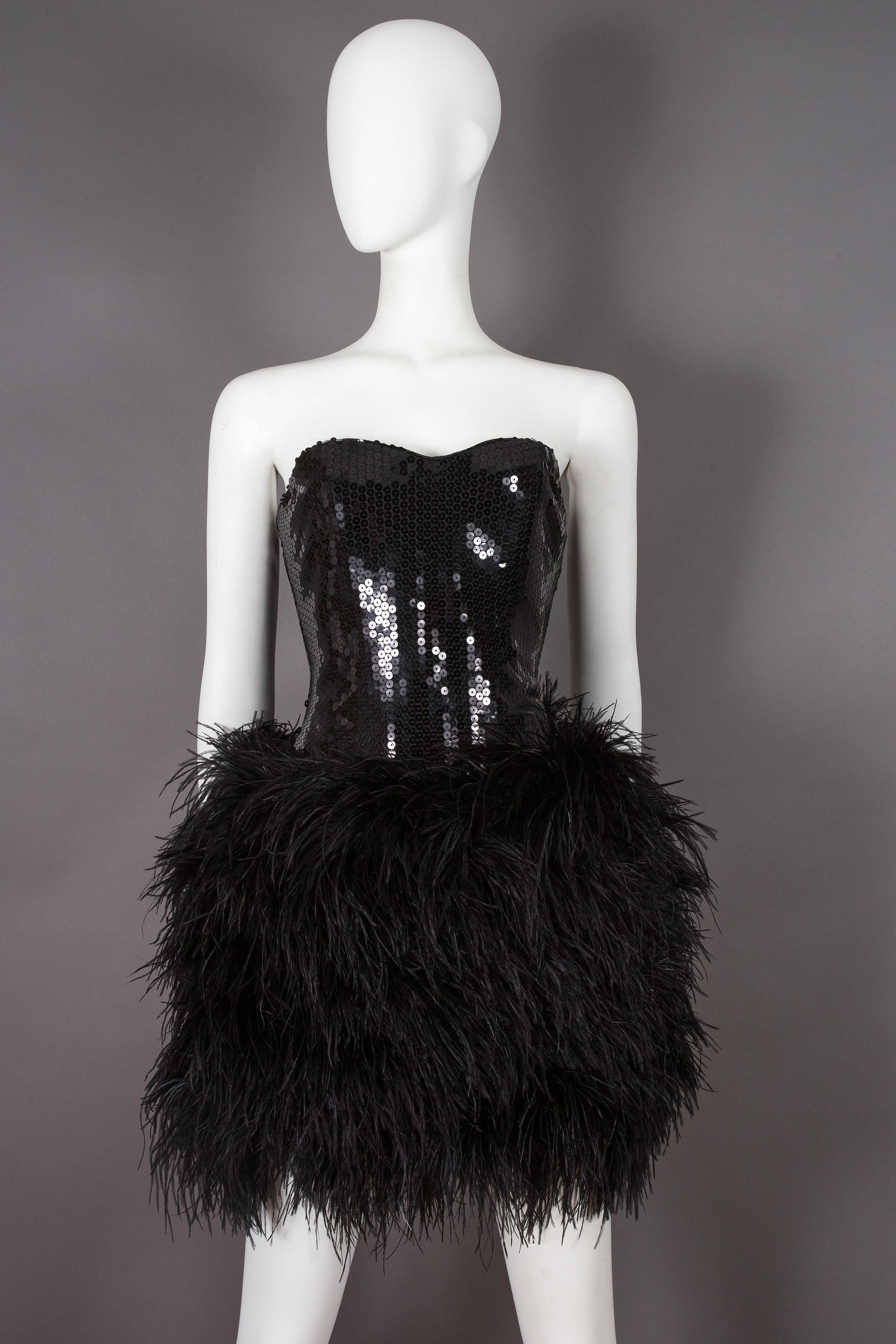 Strapless Lillie Rubin mini dress from the late 1970s. The dress features a structured sequinned bodice with internal boning and a pronouced black ostrich feather mini skirt. 