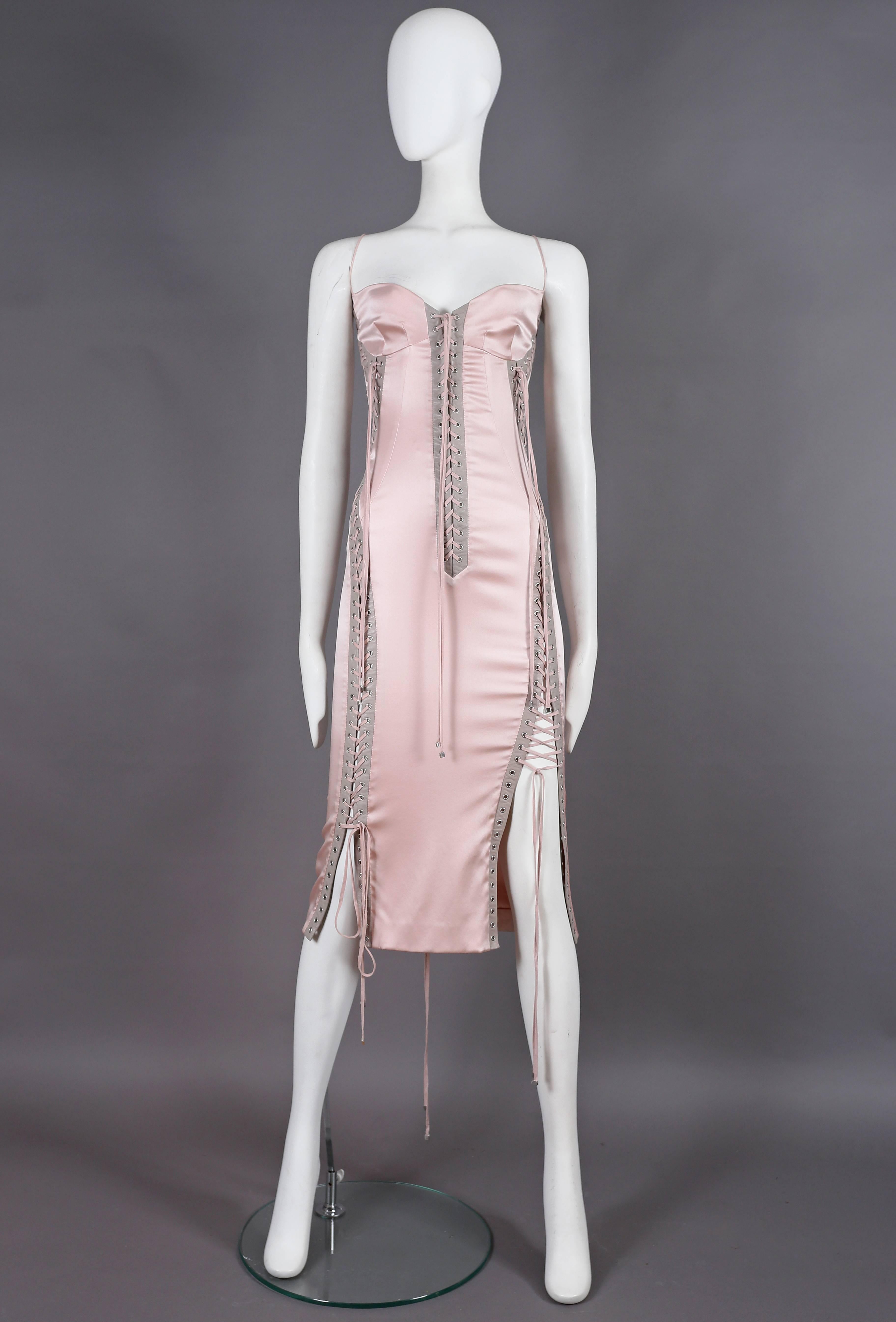 A fine and rare Dolce & Gabbana corset dress in baby pink silk with lambskin leather trim from the spring-summer 2003 collection. 

The dress features multiple lace-up fastenings throughout which can be adjusted in various ways to show more skin