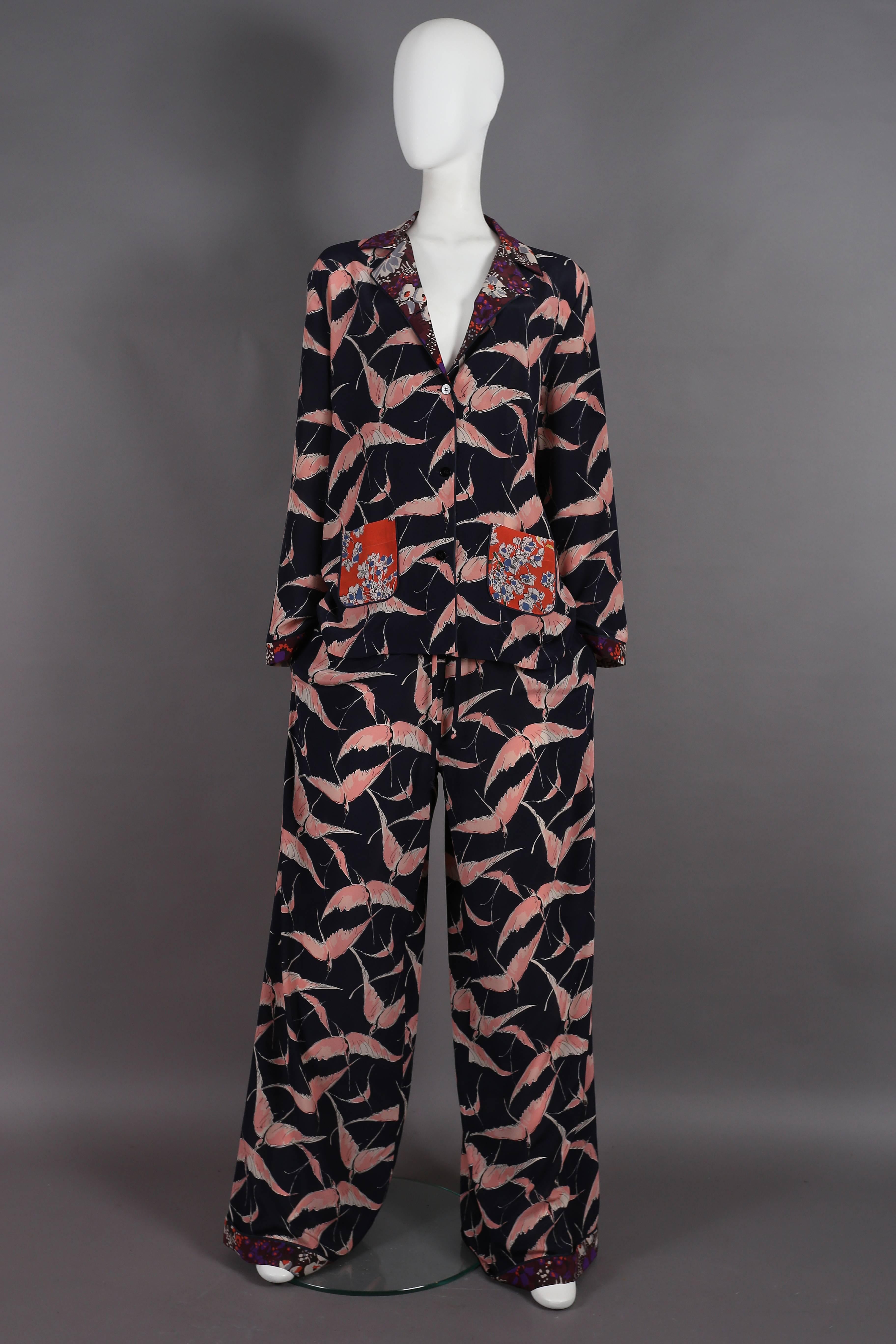 Valentino oriental style silk pant suit from the resort 2016 collection. The suit features a loose fitted jacket with button closure, mix-match printed front pockets and drawstring wide leg pants with two side pockets. 

The suit is labelled large