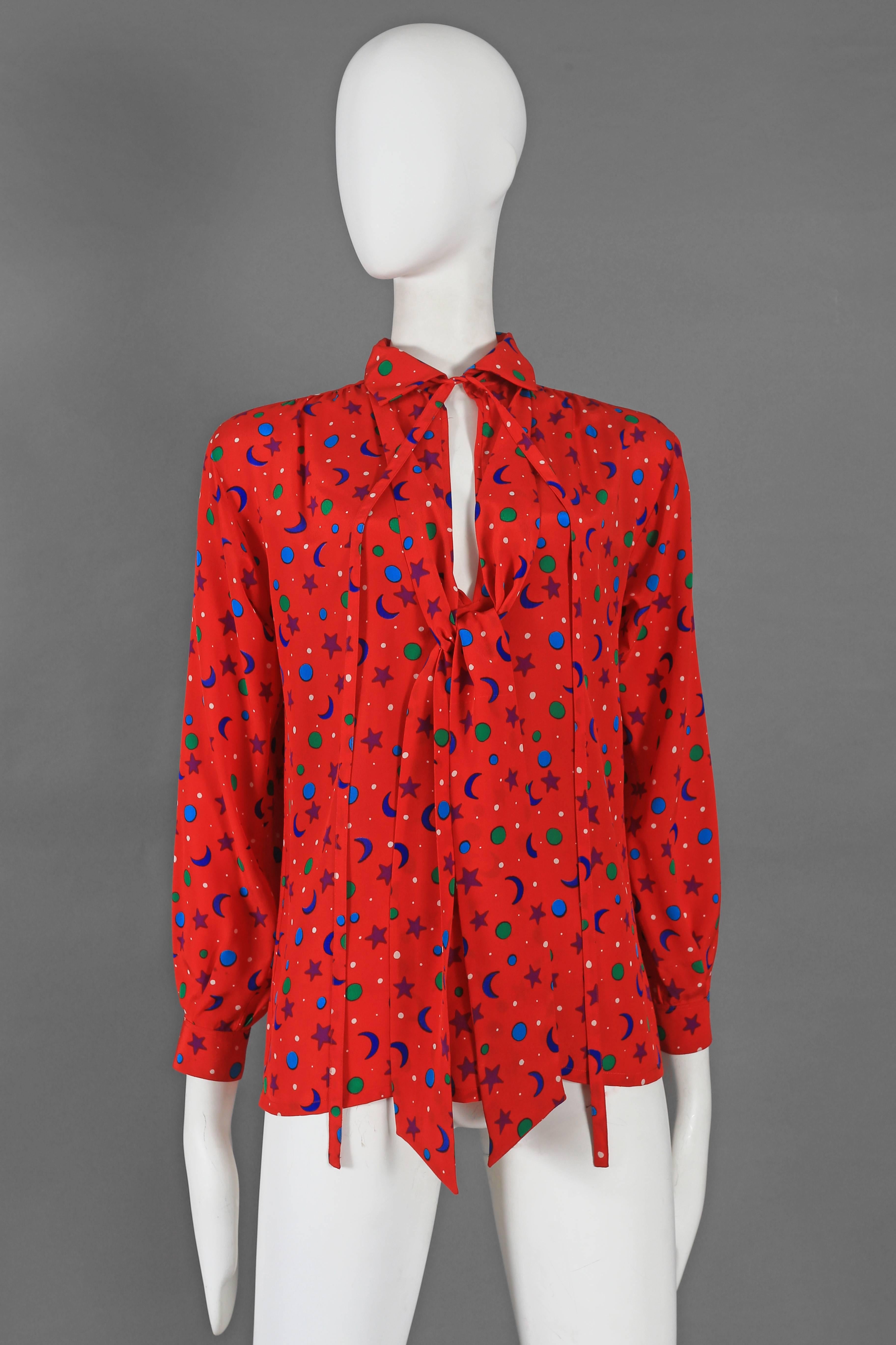 Red Yves Saint Laurent silk star and moon print pussy bow blouse, circa 1970