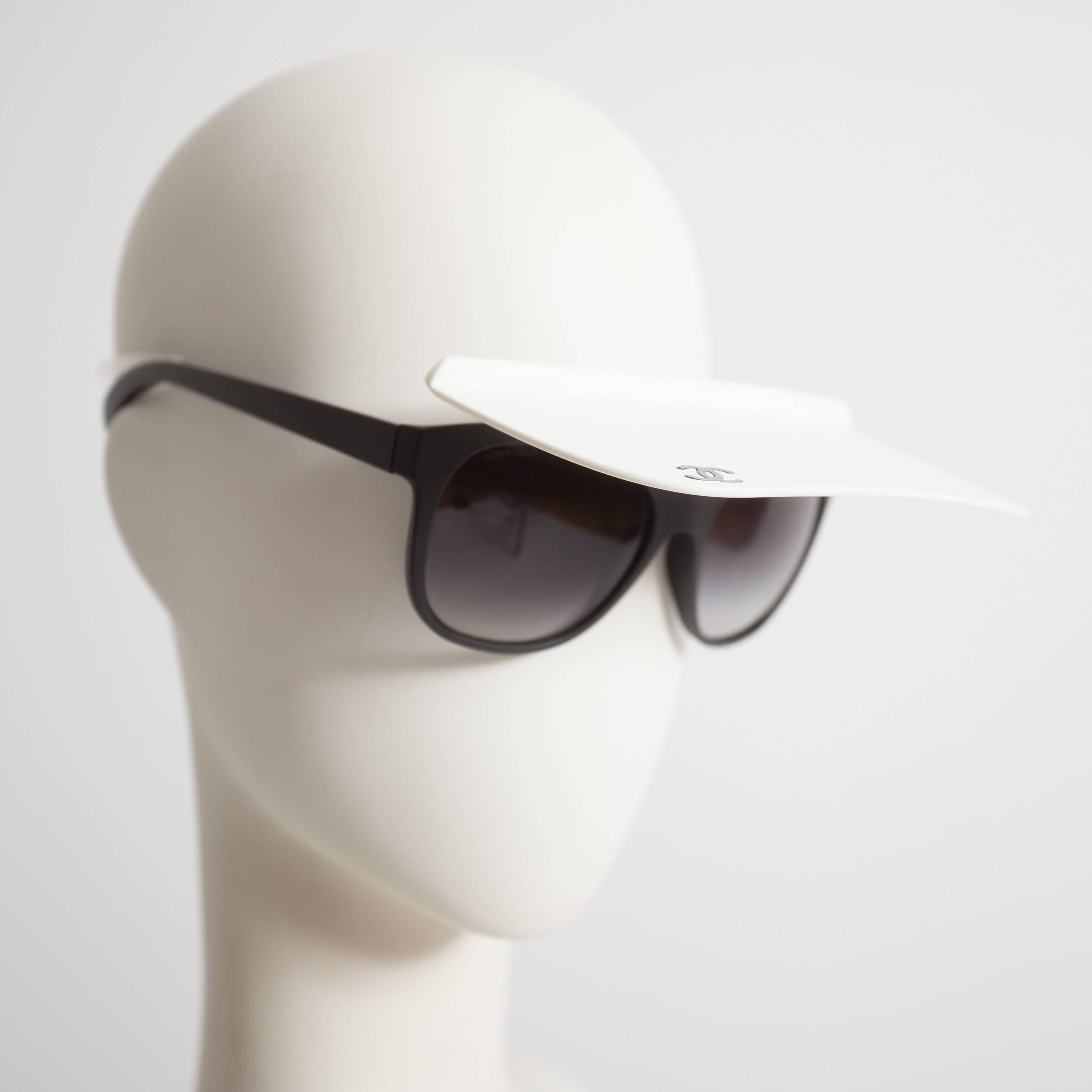 Rare Karl Lagerfeld for Chanel visor sunglasses, spring-summer 2014. Feature attached white visor with 'CC' logo and original case.