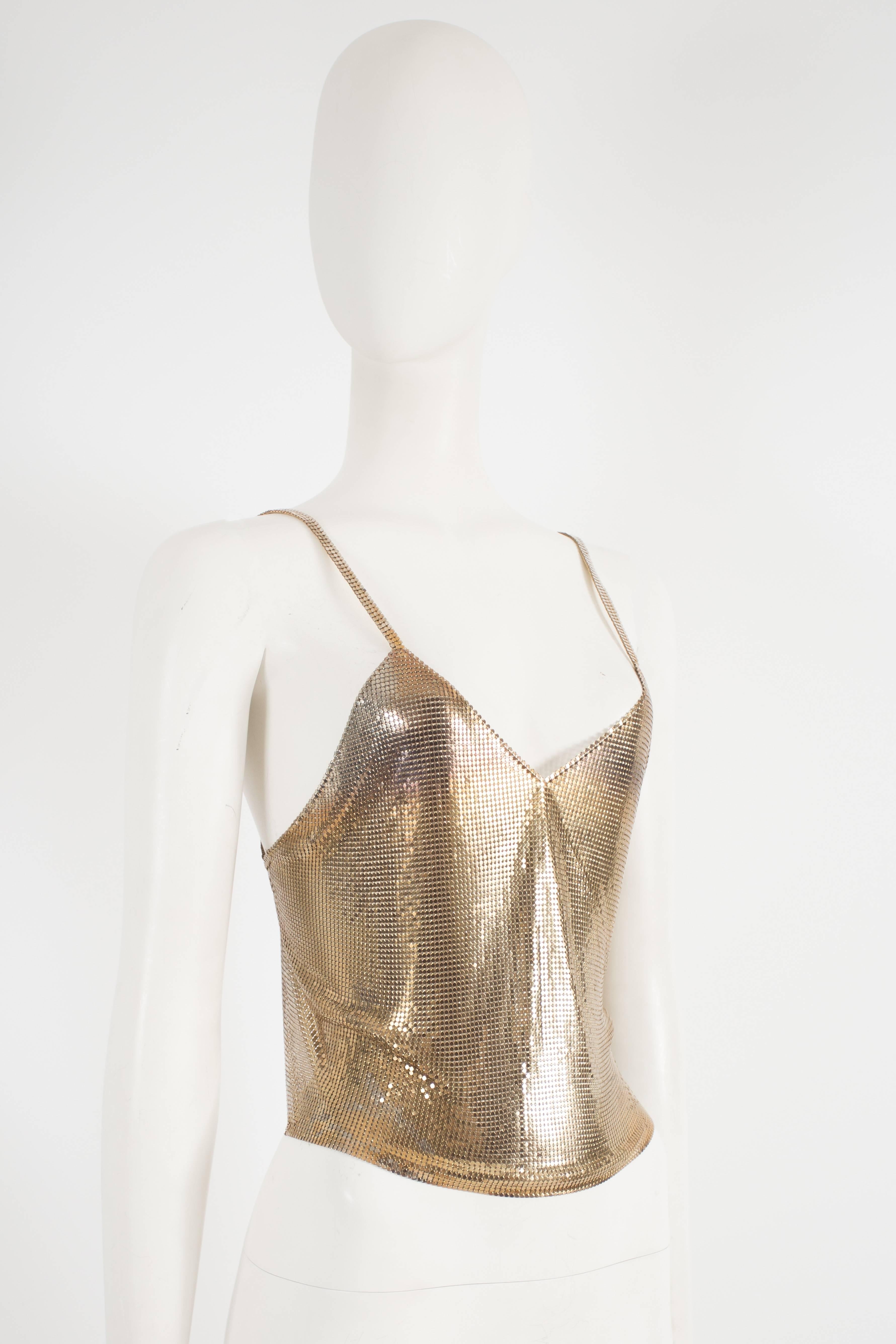 Rare Paco Rabbane gold chainmail evening vest, circa 1968. Constructed in the gold-tone chainmail, featuring an open back, two spaghetti straps, lobster clasp with adjustable length chain and original Paco Rabanne tag.