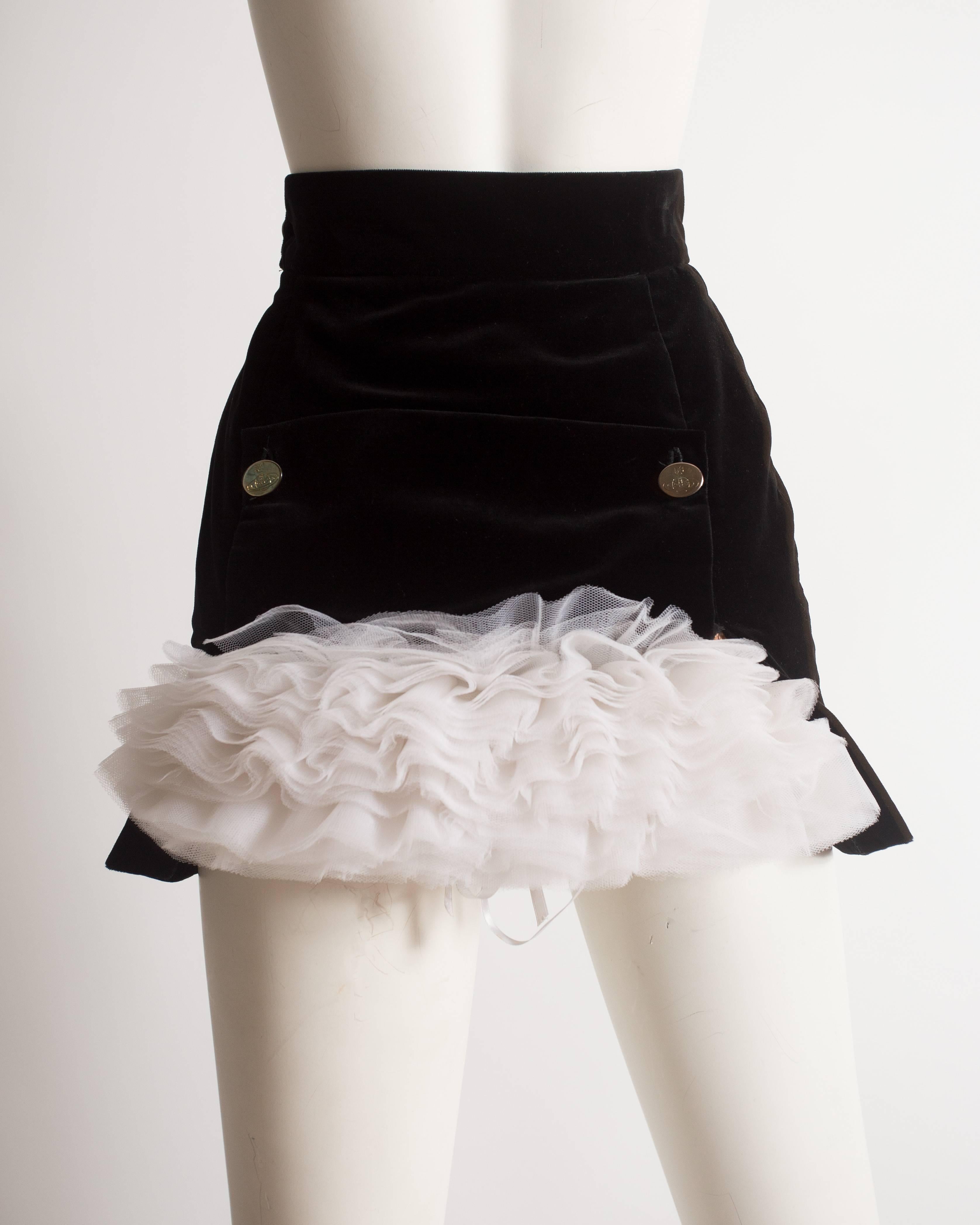 Important Vivienne Westwood black velvet mini skirt with white tulle crinoline at the rear with broderie anglaise trim. 

Autumn-Winter 1991 
