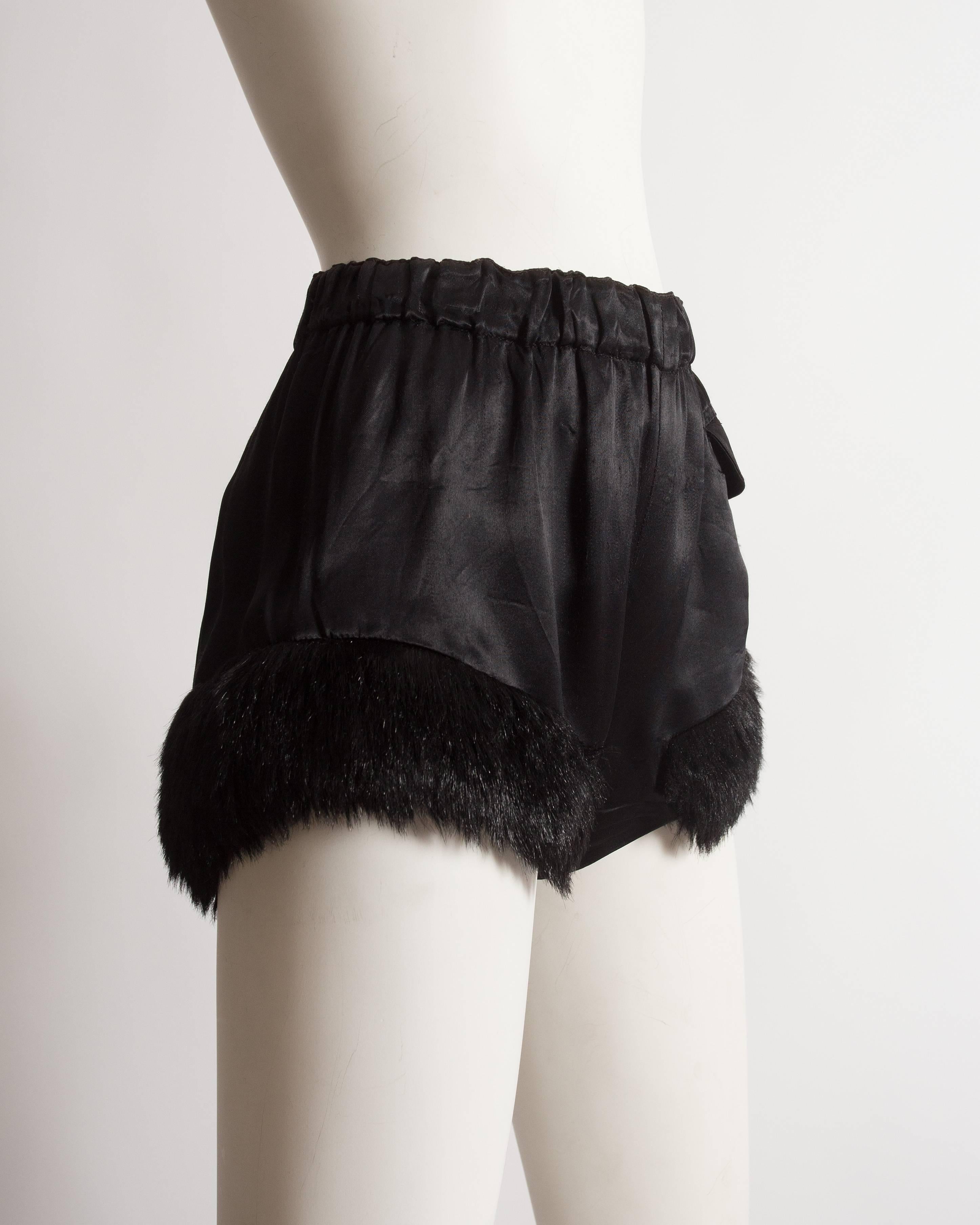 Vivienne Westwood black satin mini shorts with faux fur trim and elastic waist.

Autumn-Winter 1991