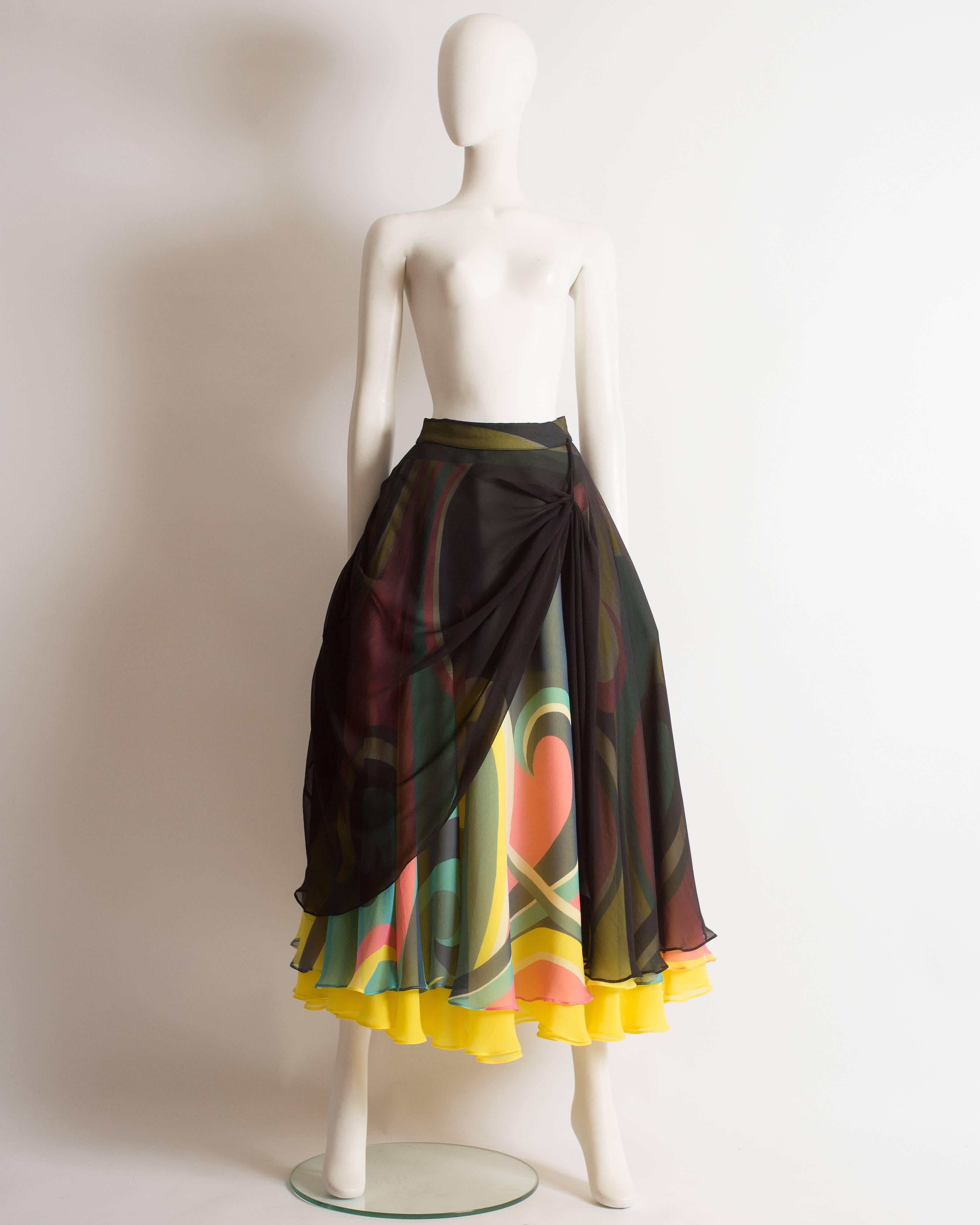 Yohji Yamamoto silk chiffon evening skirt, autumn-winter 2005. The skirt is constructed with four layers of silk and an internal wool peplum. The black chiffon layer can be draped by using the snap button and ribbon fastenings around the skirt. 

