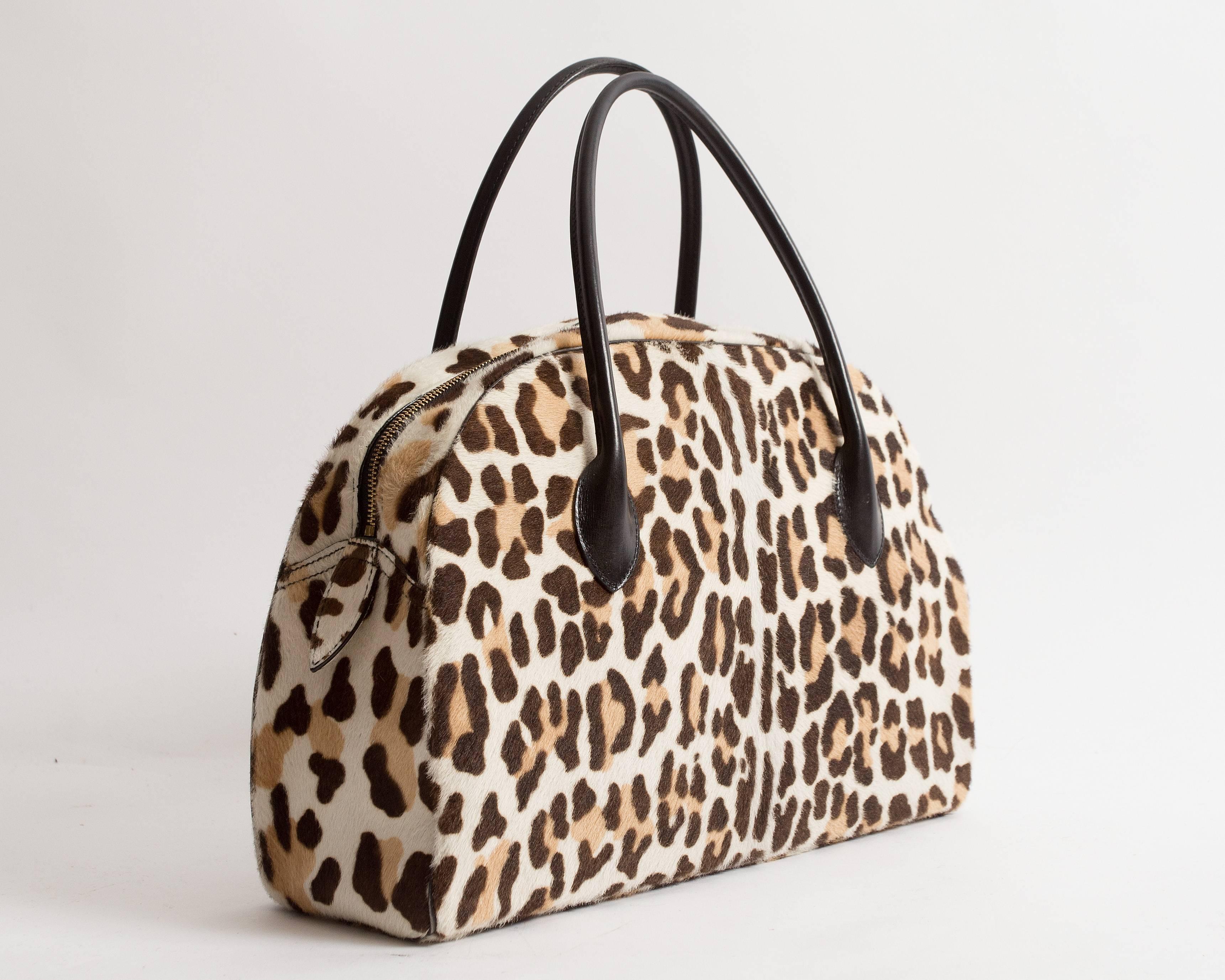 Alaia large pony hair leopard print tote bag with black leather handles, gold metal zip closure, and black leather interior. 

Measurements:

HEIGHT 11