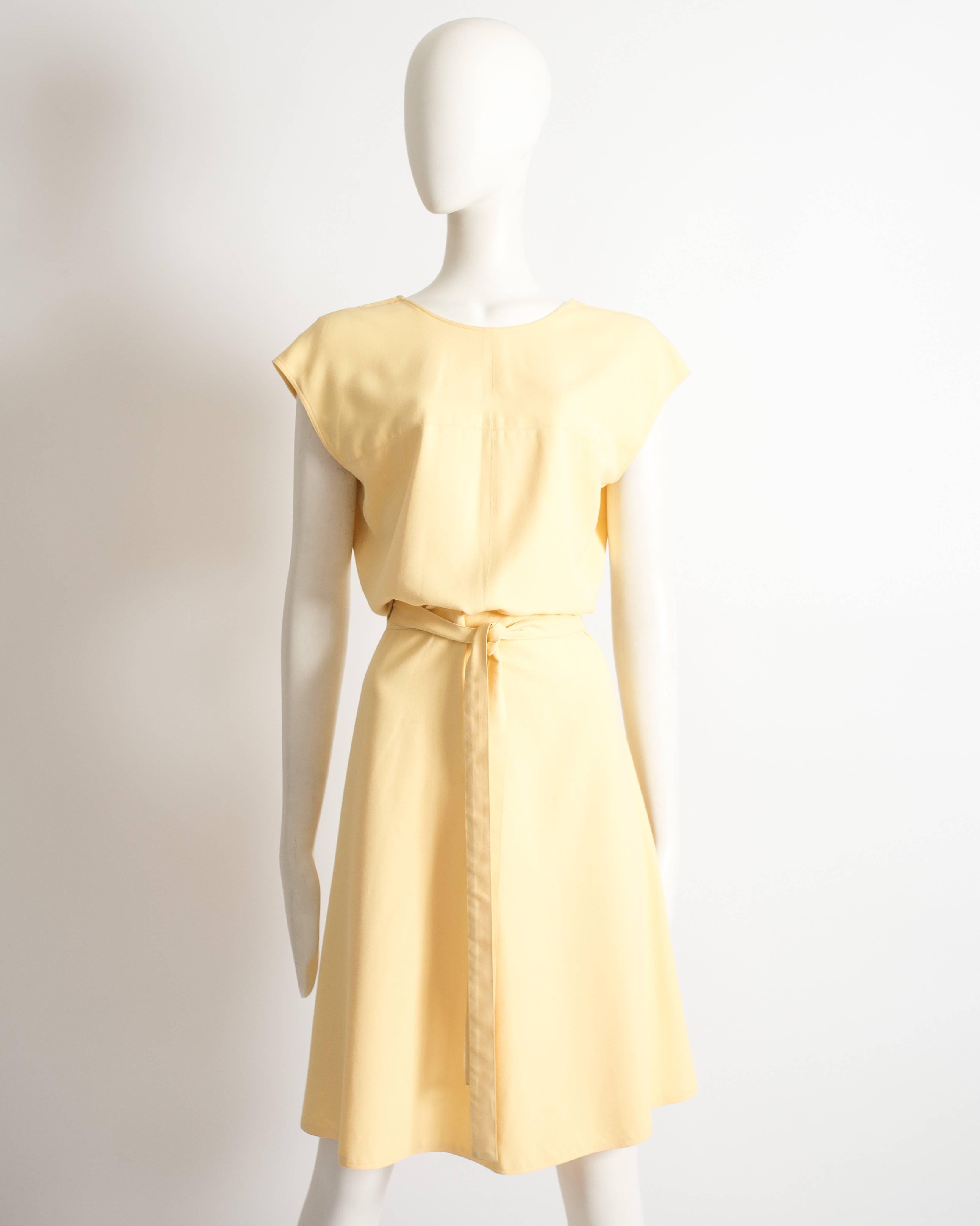 Alaia yellow cotton wrap dress, Spring-Summer 1990. Long waist belt fastening, v-neckline at the back and flared over the knee skirt.