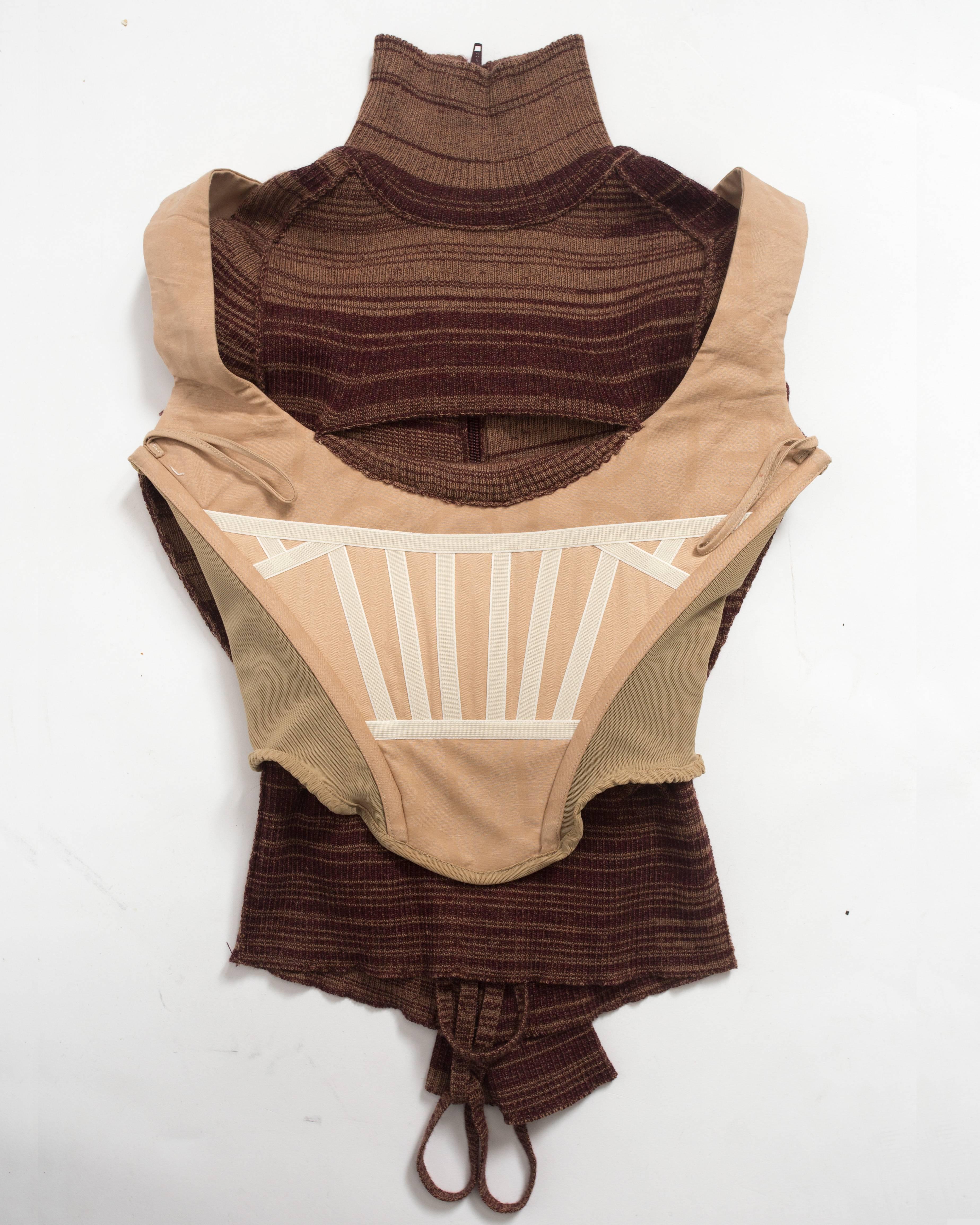 Vivienne Westwood striped wool sweater with internal corset, zip closure at the back and cut out cleavage. 