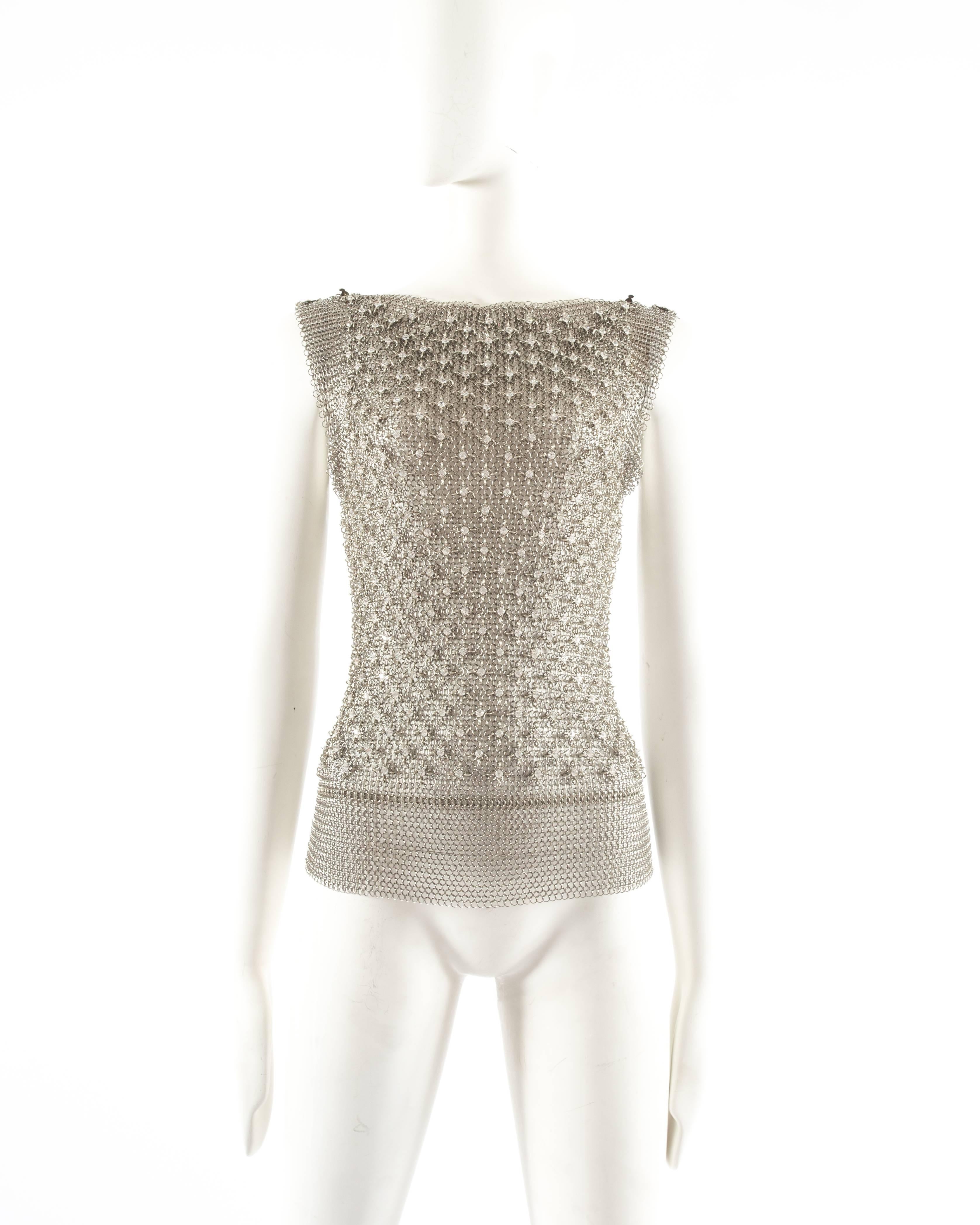 Paco Rabanne silver metal chainmail vest 

- four metal clasp closures on the shoulders
- over 400 studded Swarovski crystals on the front