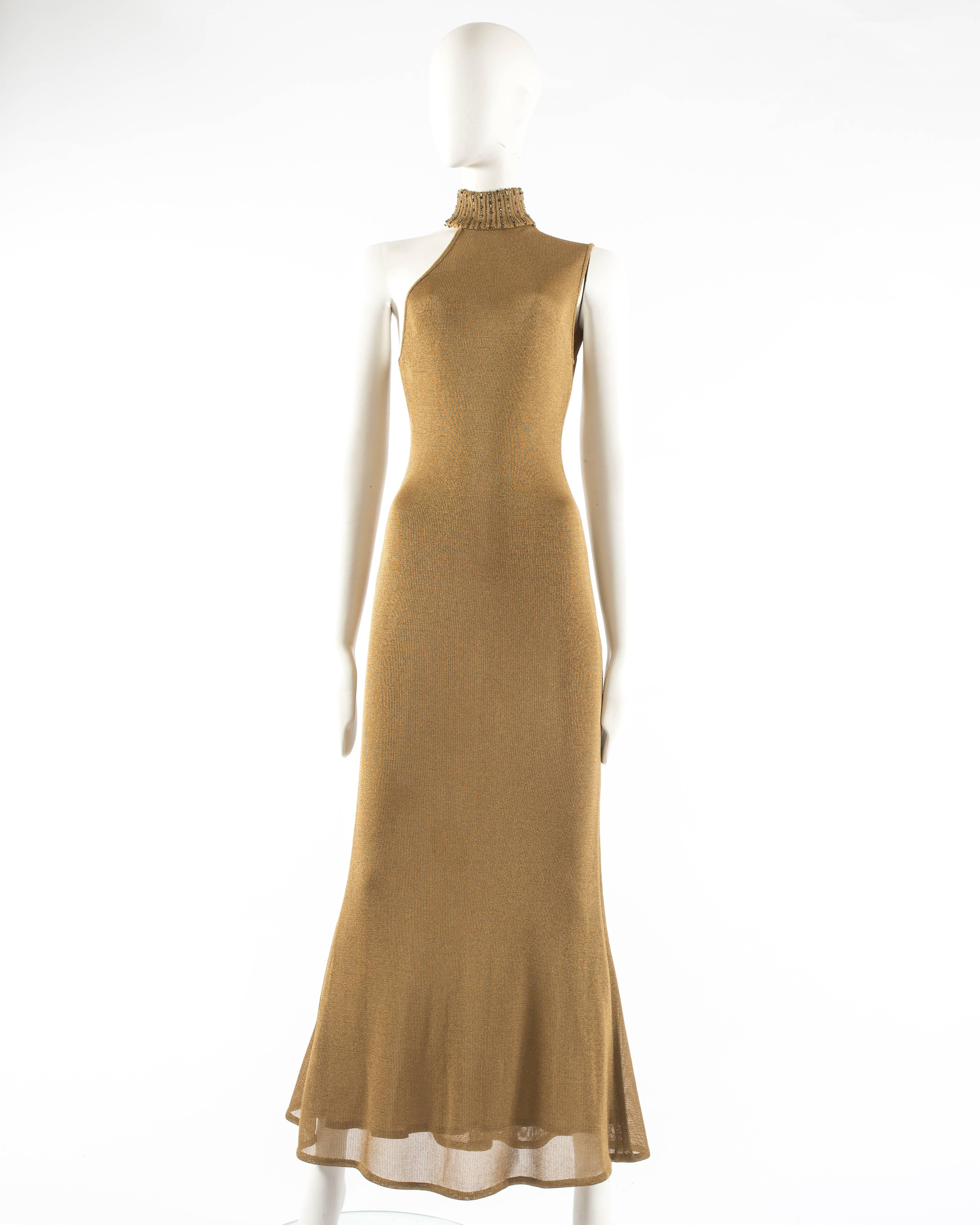Gianni Versace 1997 gold knitted evening dress

- beaded ribbed turtle neck
- asymmetric design 
- flared skirt 
- zip closure at the back