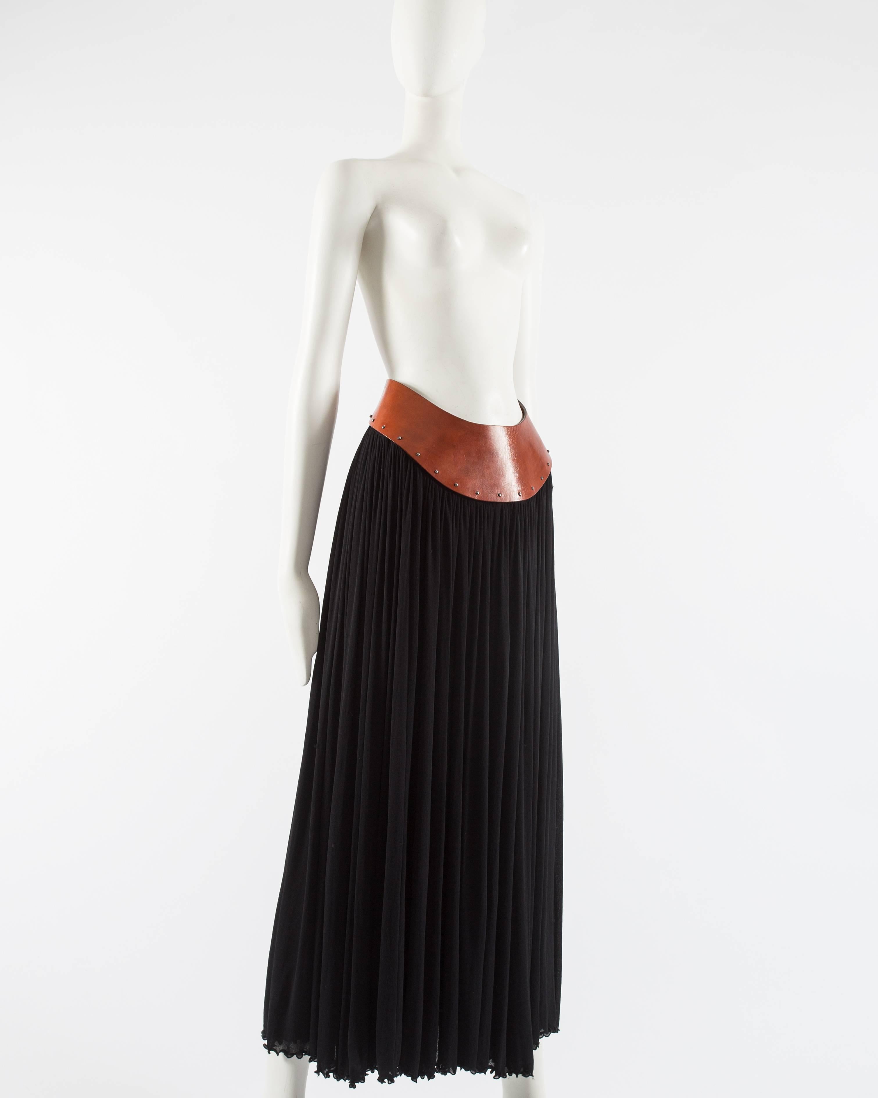 Presenting a stunning Jean Paul Gaultier skirt from the Spring-Summer 2000 collection, a true representation of the designer's bold and innovative style. This skirt exudes elegance and sophistication, showcasing Gaultier's impeccable craftsmanship