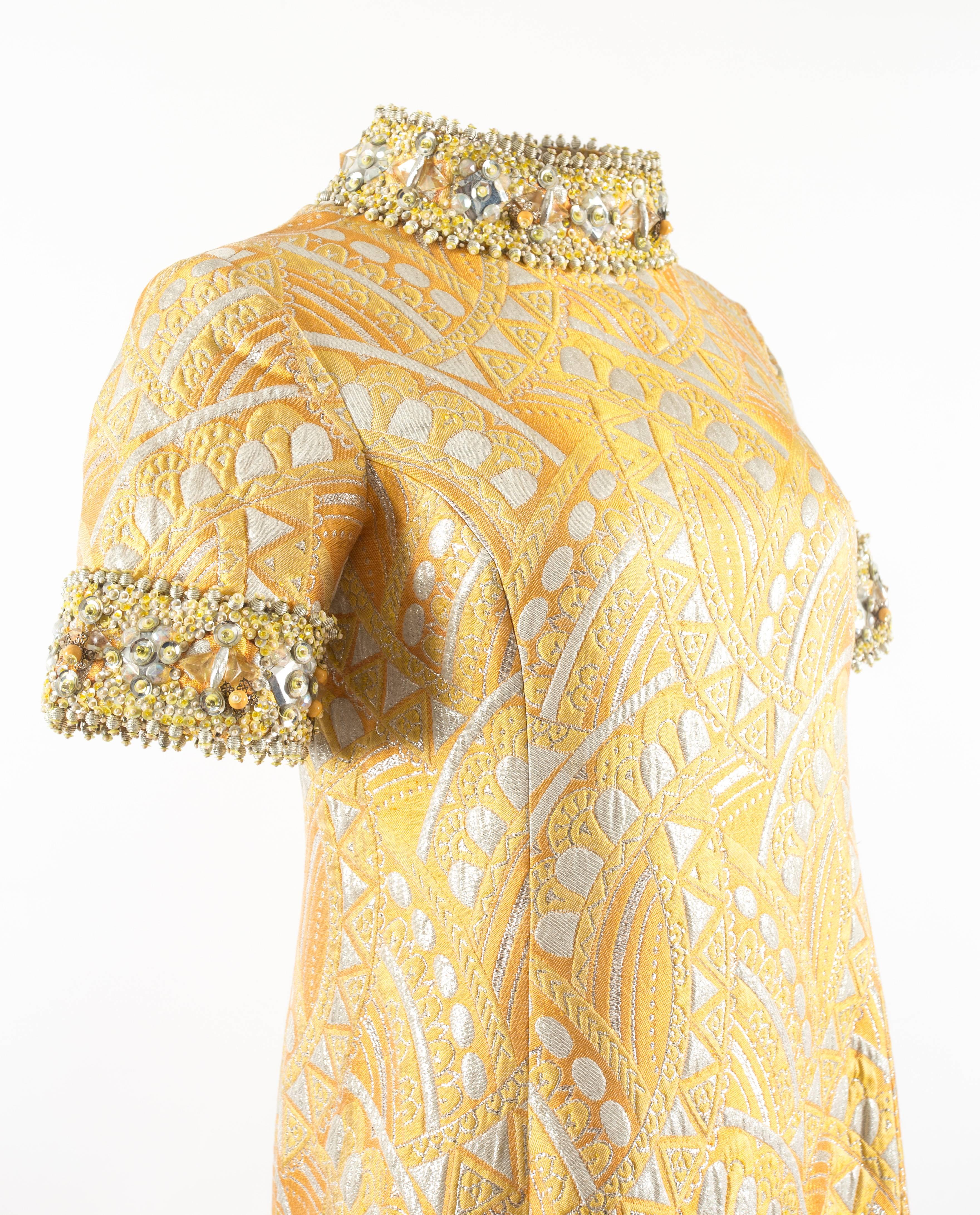 Bellvile Sassoon 1968 A-line brocade embellished evening dress.

The dress was designed by Belinda Bellville in the 1960s under her own label 'Bellville' which later became Bellville Sassoon by name in 1970 by the partnership of David Sassoon.