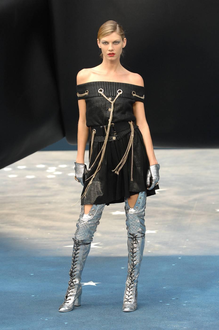 Chanel Spring-Summer 2008 thigh high metallic silver boots

- laser cut leather 
- rounded cap-toes
- chunky heel
- black cord lace-up ties 
- inner concealed zip closure

