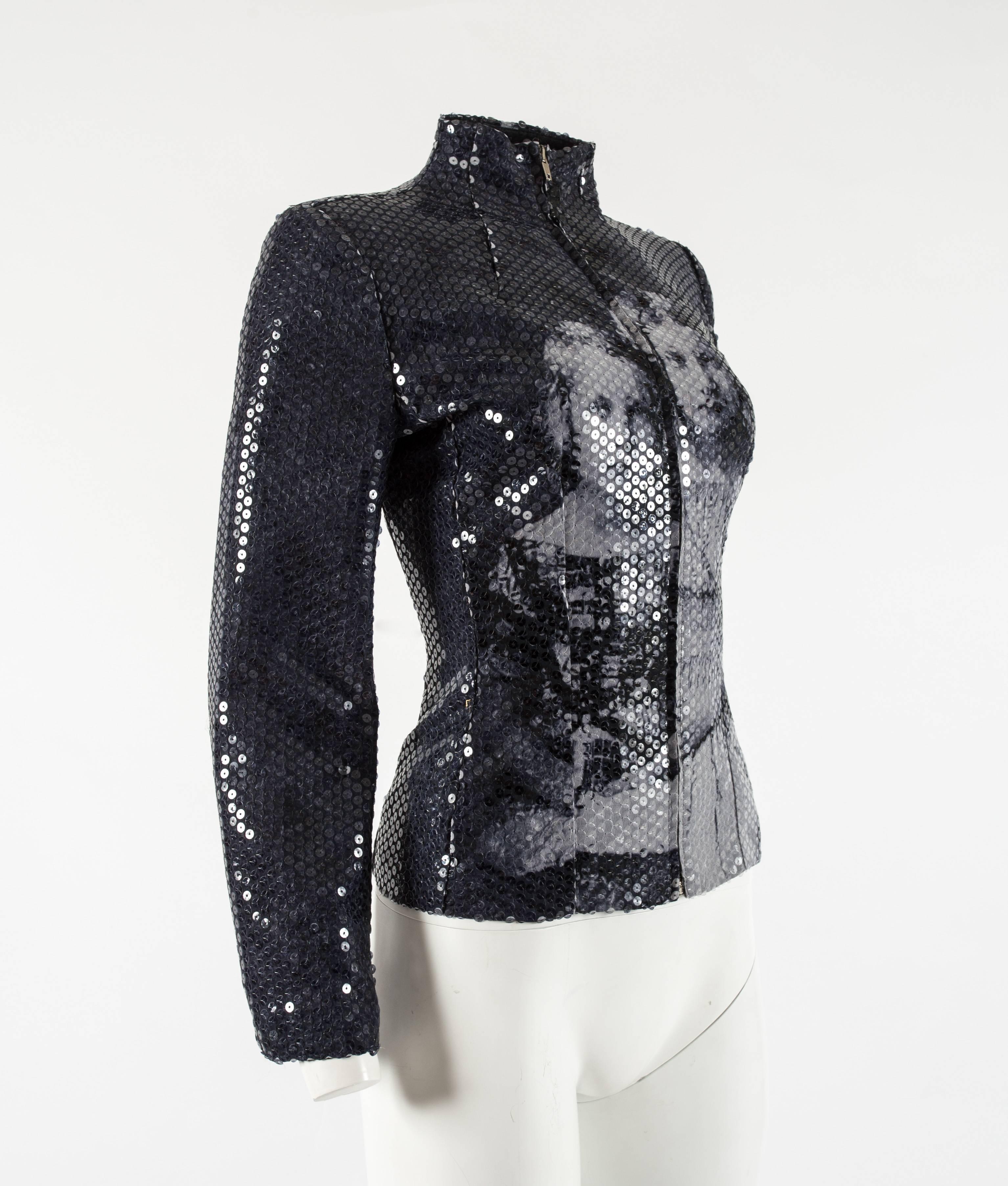 Introducing the Alexander McQueen Autumn-Winter 1998 'Joan' sequin jacket, a truly extraordinary piece that reflects the late designer's profound artistic vision and storytelling.

This jacket is an homage to history, fully sequinned in a repetitive