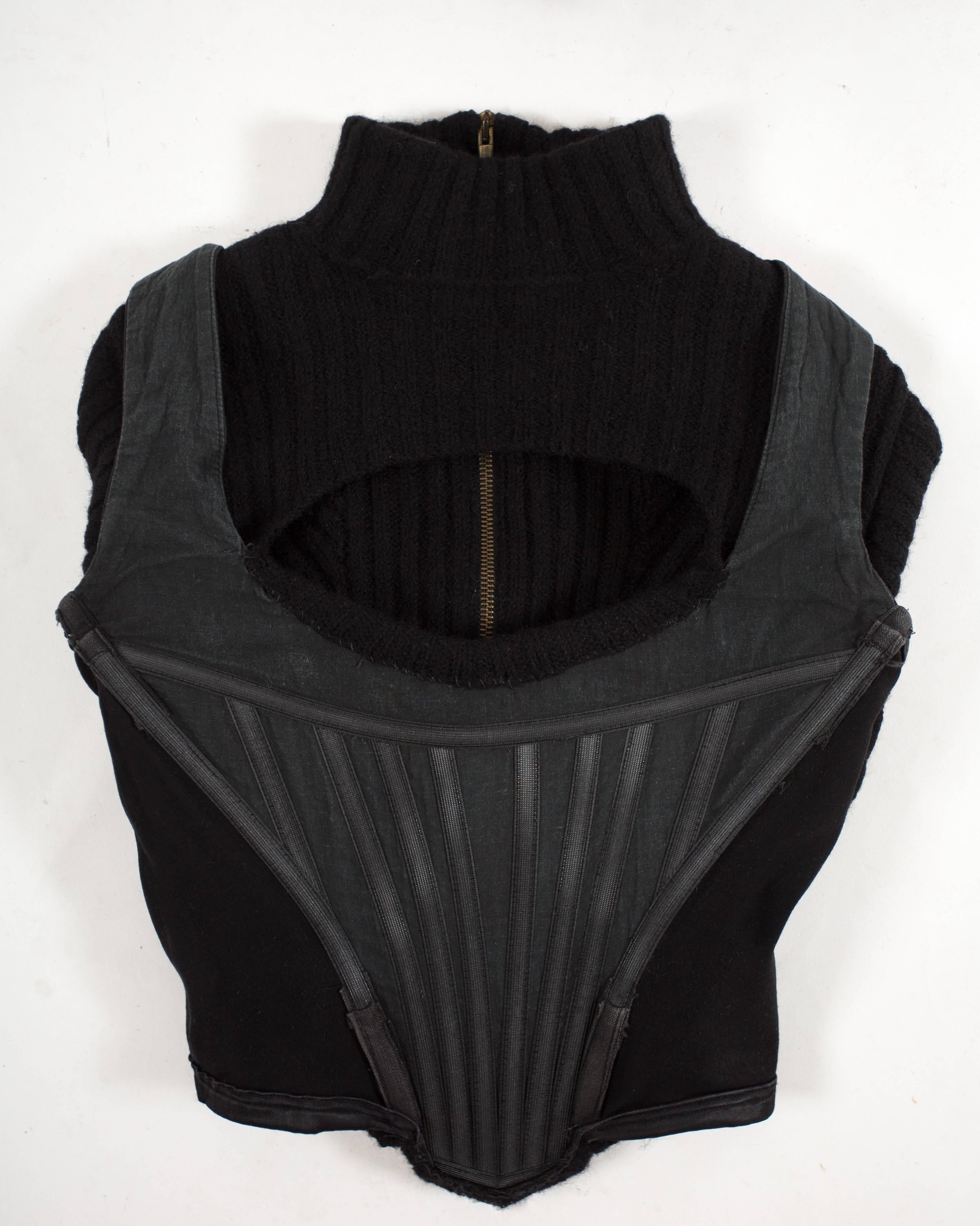 Black Vivienne Westwood Autumn-Winter 1991 knitted corset with cut out and large orb