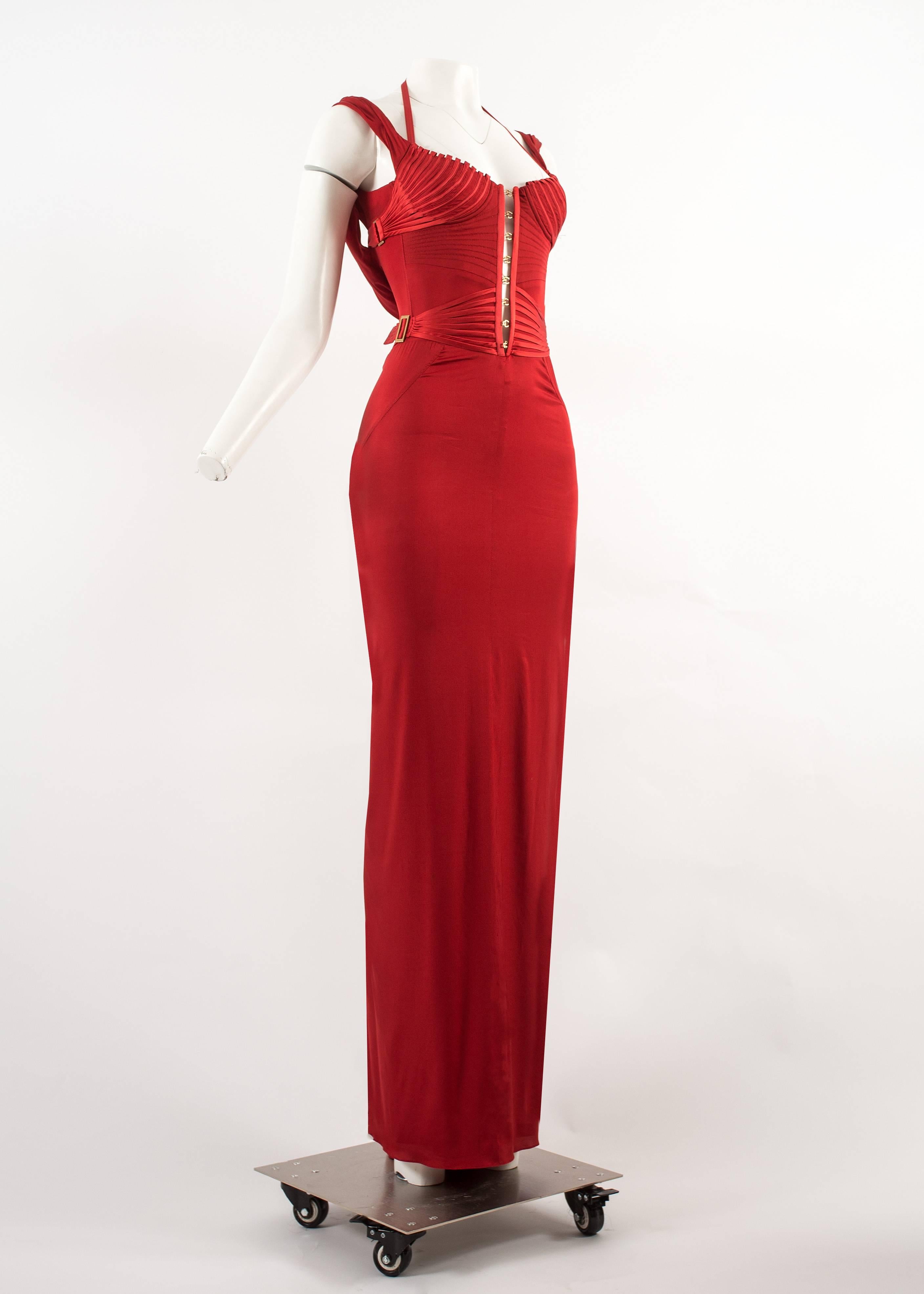 Tom Ford for Gucci Autumn-Winter 2003 red corseted evening gown 

- red silk spandex
- boned bodice 
- metal hook and bar closures 
- zip fastening at rear
- halter neck strap 
- It 40 / Fr 36 / UK 8 