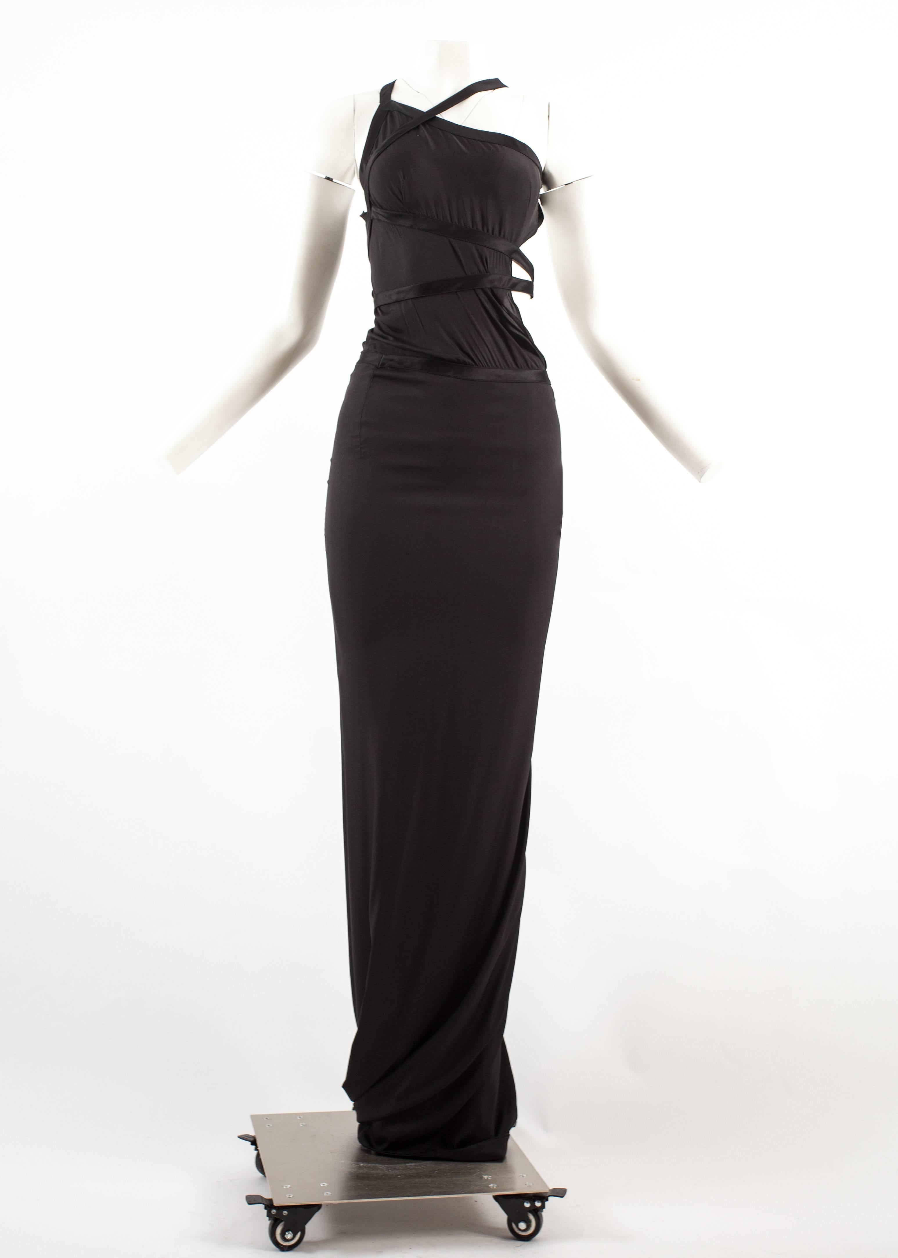 Tom Ford for Gucci Autumn-Winter 2003 black silk bondage evening dress

- Open back
- Asymmetric bondage straps around bust and waist
- Zip closure on lower hip
- Silk and spandex