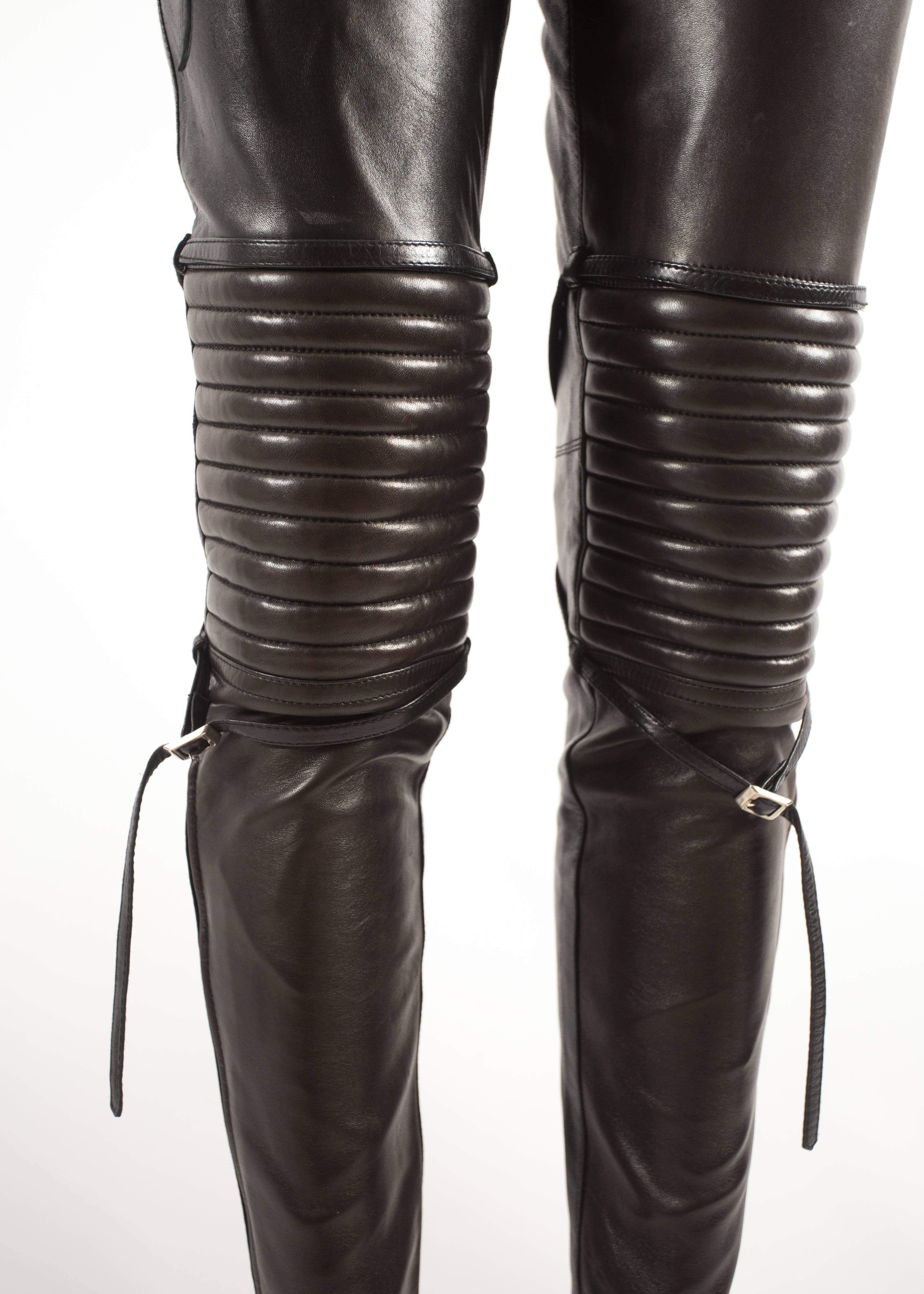 Jean Paul Gaultier Autumn-Winter 1990 black and brown leather biker pants with padding and bondage straps.