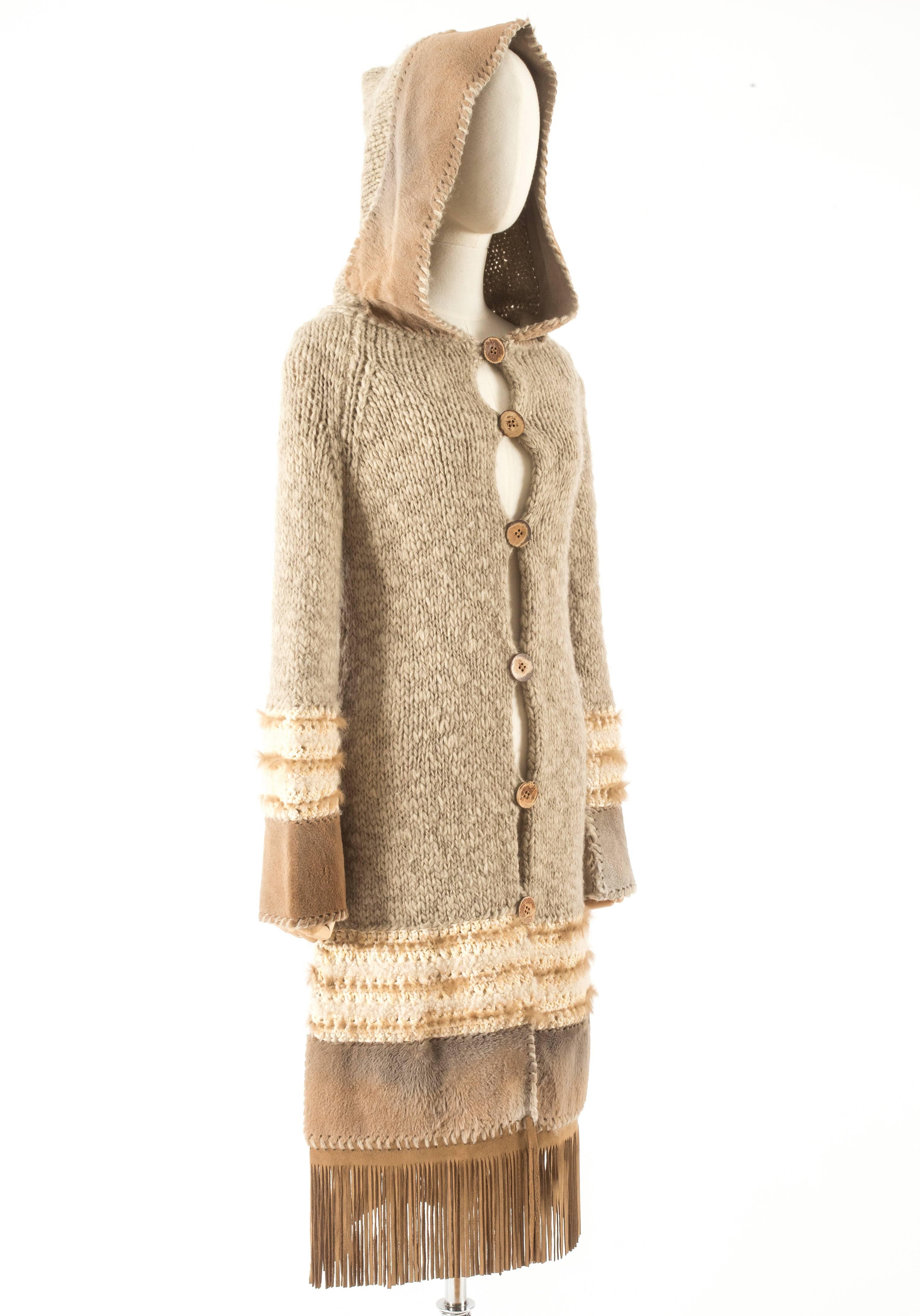 ▪ Brand: Christian Dior 
▪ Creative Director: John Galliano 
▪ Collection: Fall-Winter 2002
 ▪ Fabric: Wool, Yak, Cashmere, Nylon, Rabbit, Kangaroo, Lambskin Leather
 ▪ Details: Leather fringe trim, fur hood, wood buttons
 ▪ Size: Small
▪ Made in: