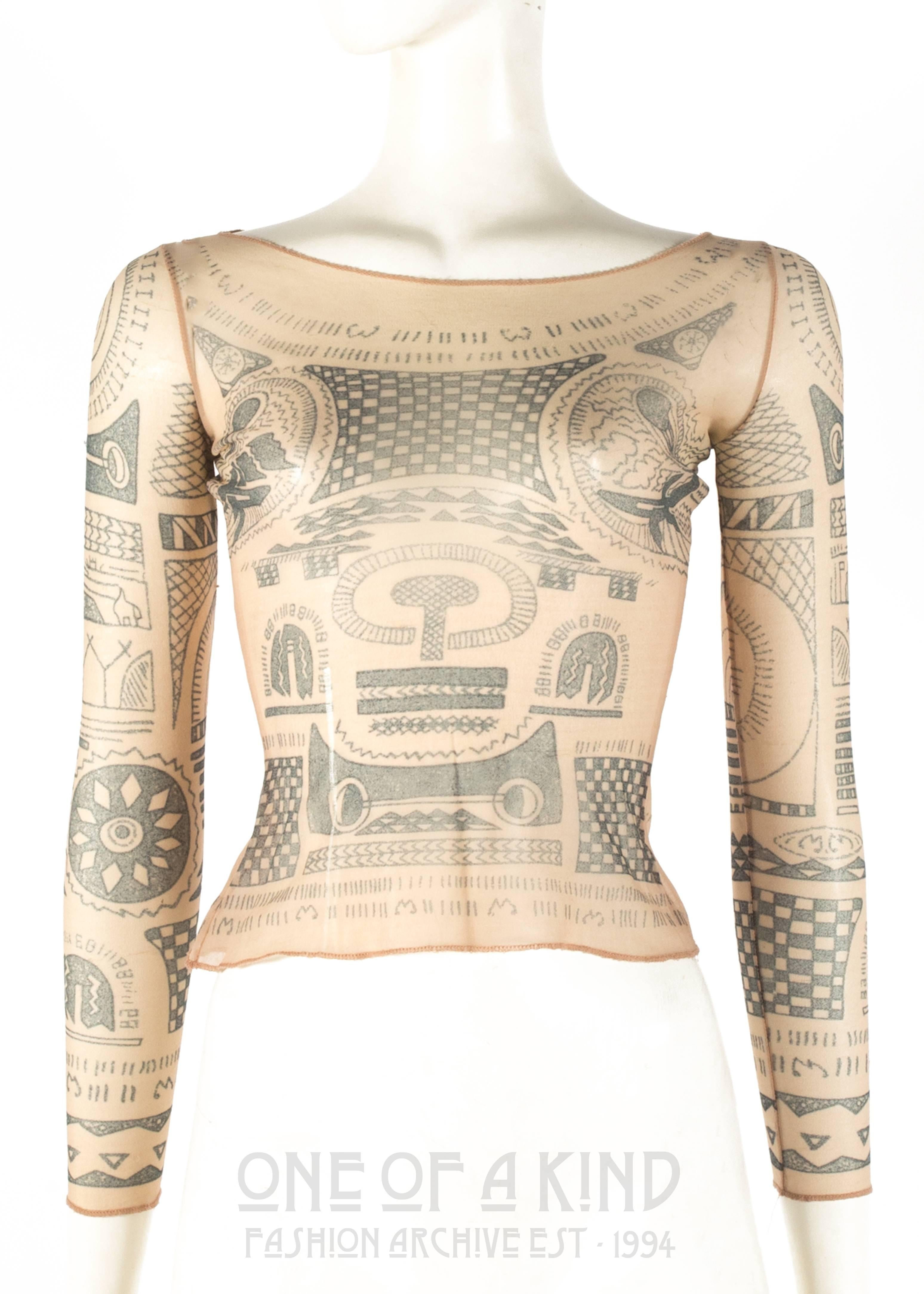 Margiela Spring-Summer 1989 trompe-l'œil tattoo mesh top 

* collectors item, from Martin Margiela's first collection 