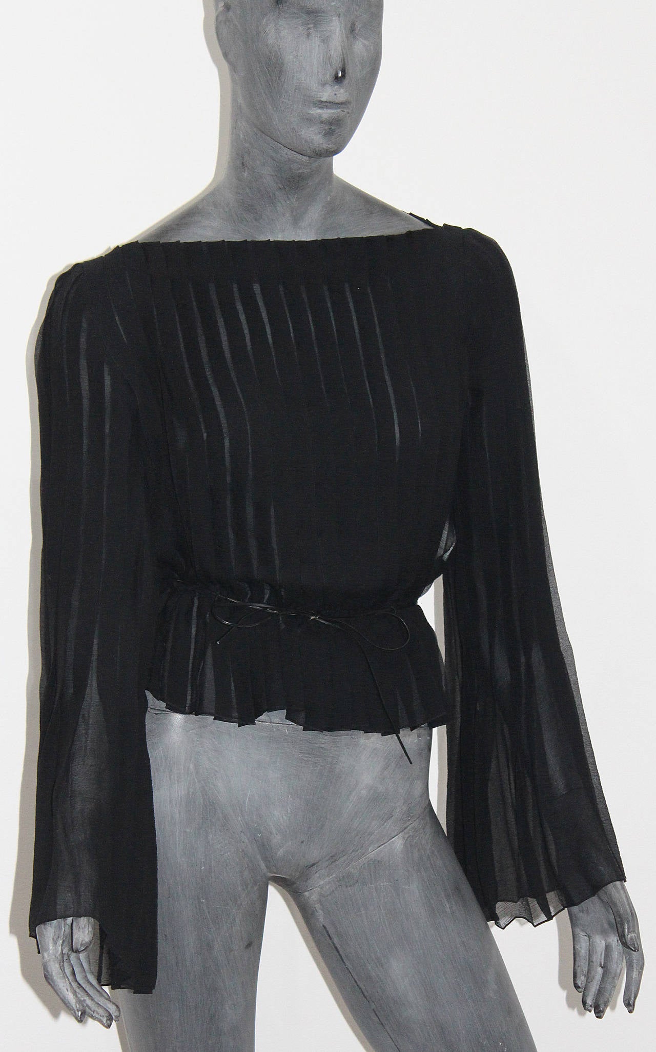 A beautiful black pleated silk chiffon blouse designed by Tom Ford for Gucci. Does not come with belt.