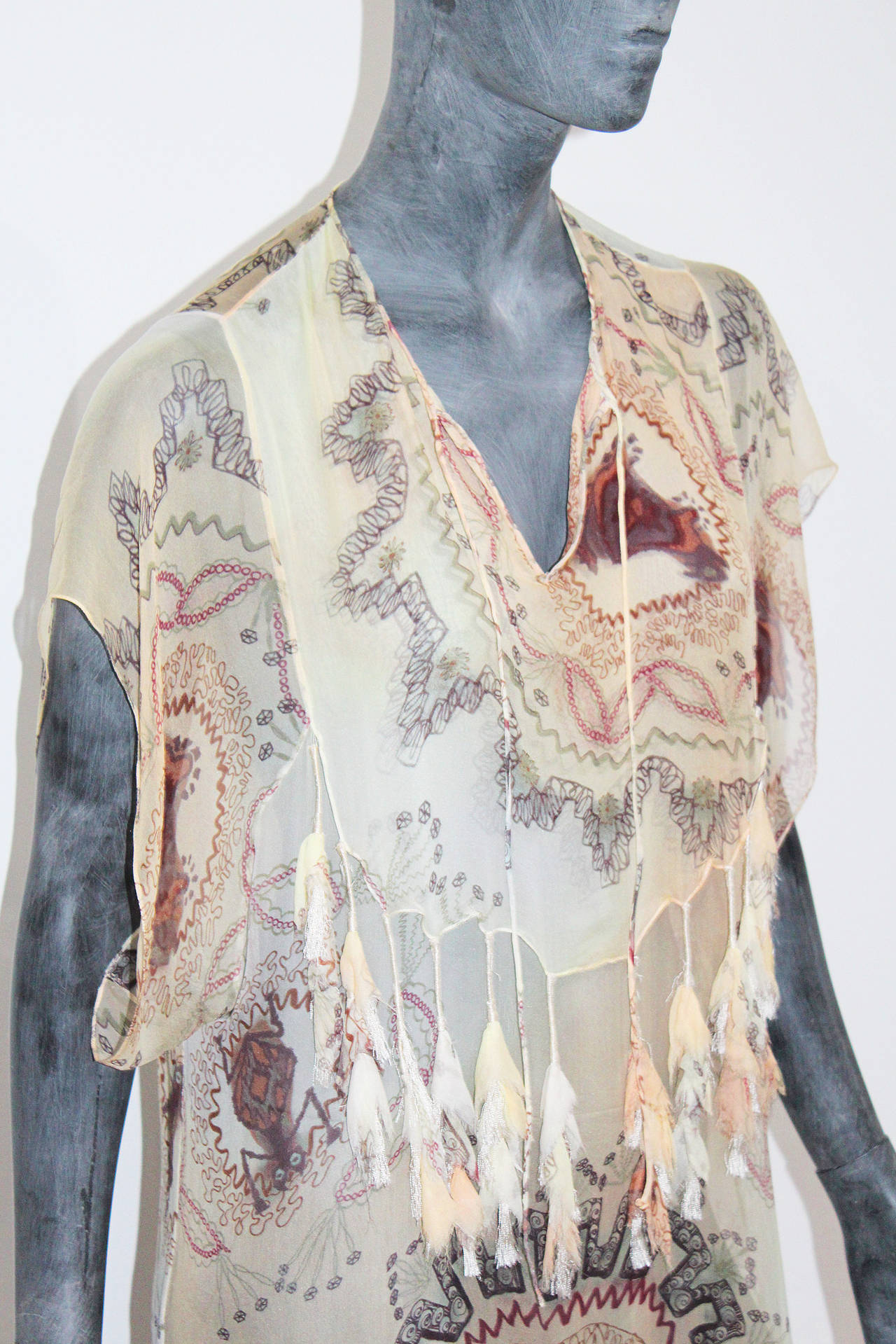 A spring/summer Christian Dior silk chiffon caftan. The caftan is to be worn over a swimsuit in the summer. 

Designed by John Galliano 

Size Small/Medium (Fr 38)