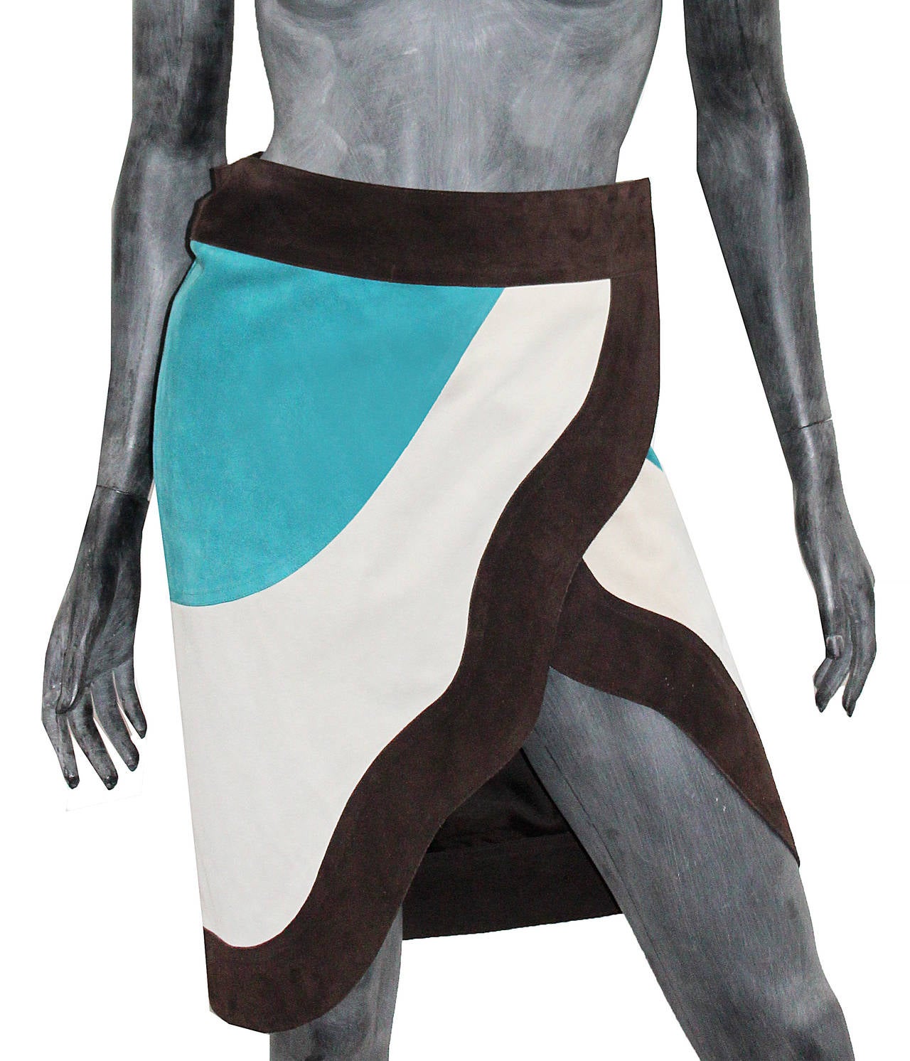 Vintage Yves Saint Laurent wrap skirt with colour block design. The dress wraps around the waist with a button and snap closure and has a leg slit. 

Label reads: 'The garment is made from a heavy suede skin. Fading colour and shedding hair are a