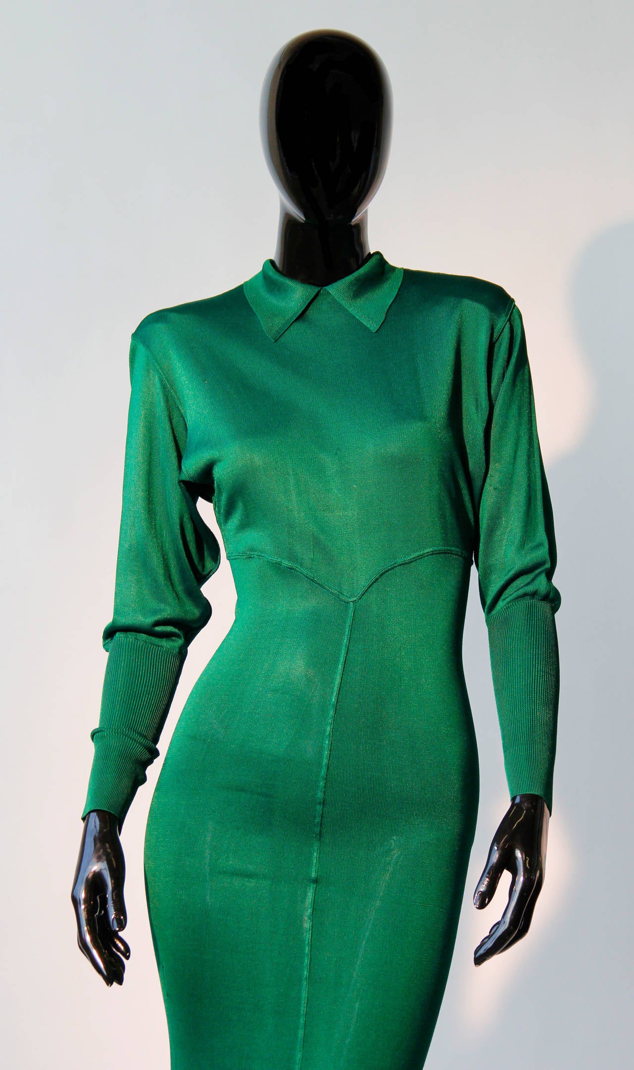 A fine and rare Alaia dress from the year 1987. The dress is in a beautiful emerald green, features a collar, open back fastening and has a unique cut which contours the female form. 

The beauty about this dress is its sex appeal, the fabric of