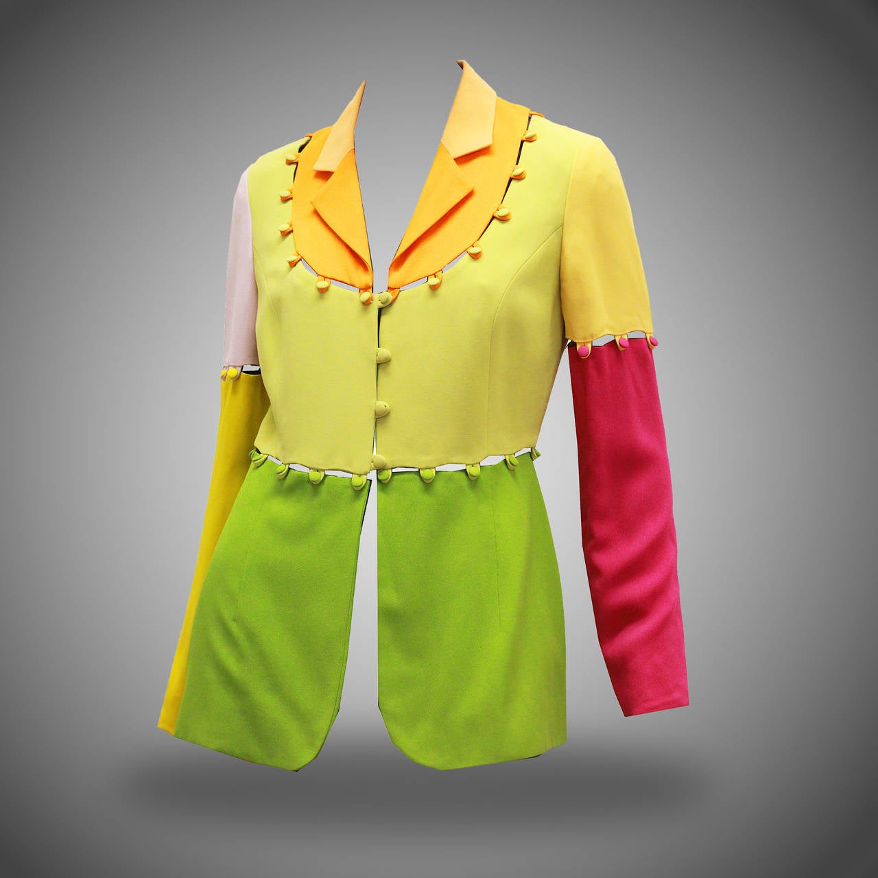 A Moschino puzzle blazer/jacket features colour block design. The beauty about this jacket is that you can adjust it to fit the occasion, the design allows the wearer to make the jacket sleeveless, have no collar or even make the jacket cropped.