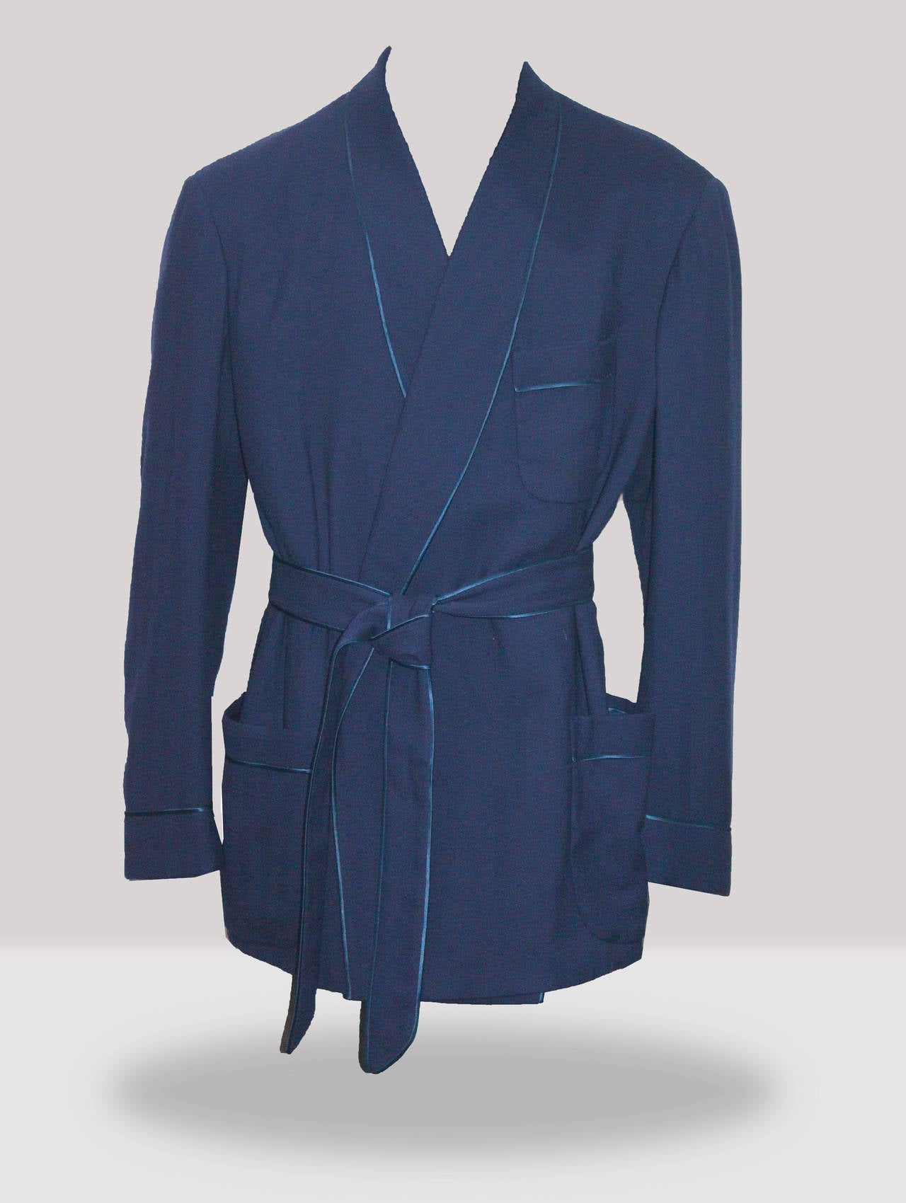 A fine and rare 1940s smoking jacket by the prestigious Amos Sulka (A. Sulka and Co.). The jacket is made from the finest wool and the softies Royal Blue silk which lines the jacket and the pockets. 

The jacket is in immaculate condition.

Made