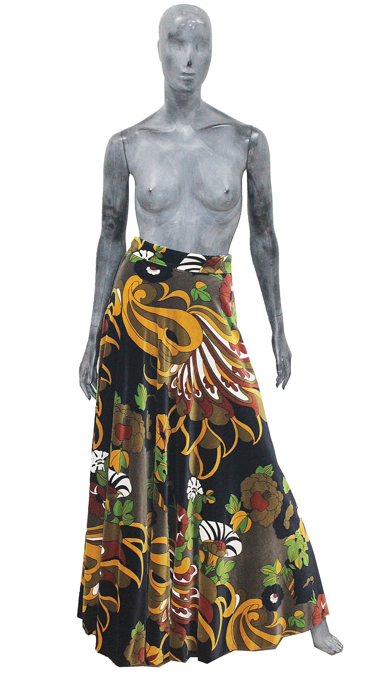 A brilliant skirt from Gina Fratini, the skirt is in velvet with a classic 1960s psychedelic print in a ray of brown, deep blue, mustard and green. 

Gina Fratini was a favourite amongst the Royal family especially Princess Diana who wore her