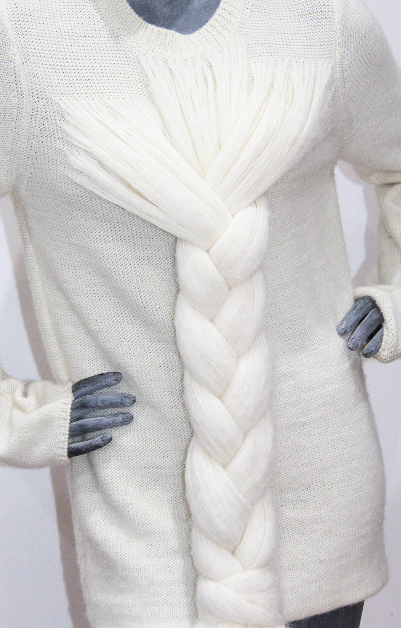 A vintage Comme des Garcons cream woollen sweater in an oversized style with a large braid. 

Unisex