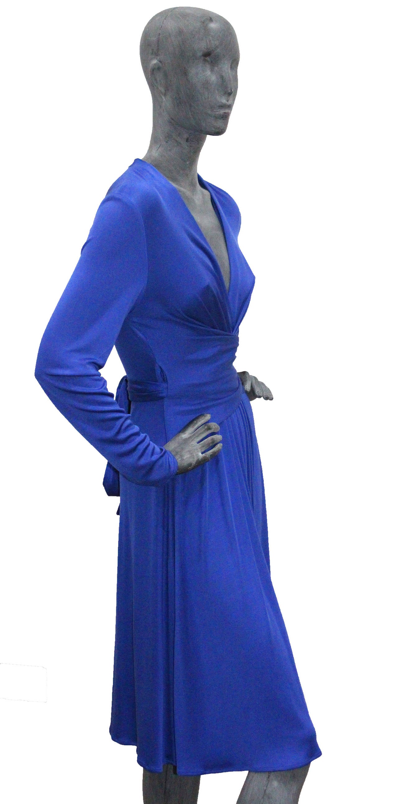 A rare silk jersey wrap dress by Issa London from 2010. Kate Middleton, The Duchess of Cambridge wore an identical dress for the royal engagement on 16 November 2010 to coordinate with the sapphire engagement ring given to her by Prince William. The