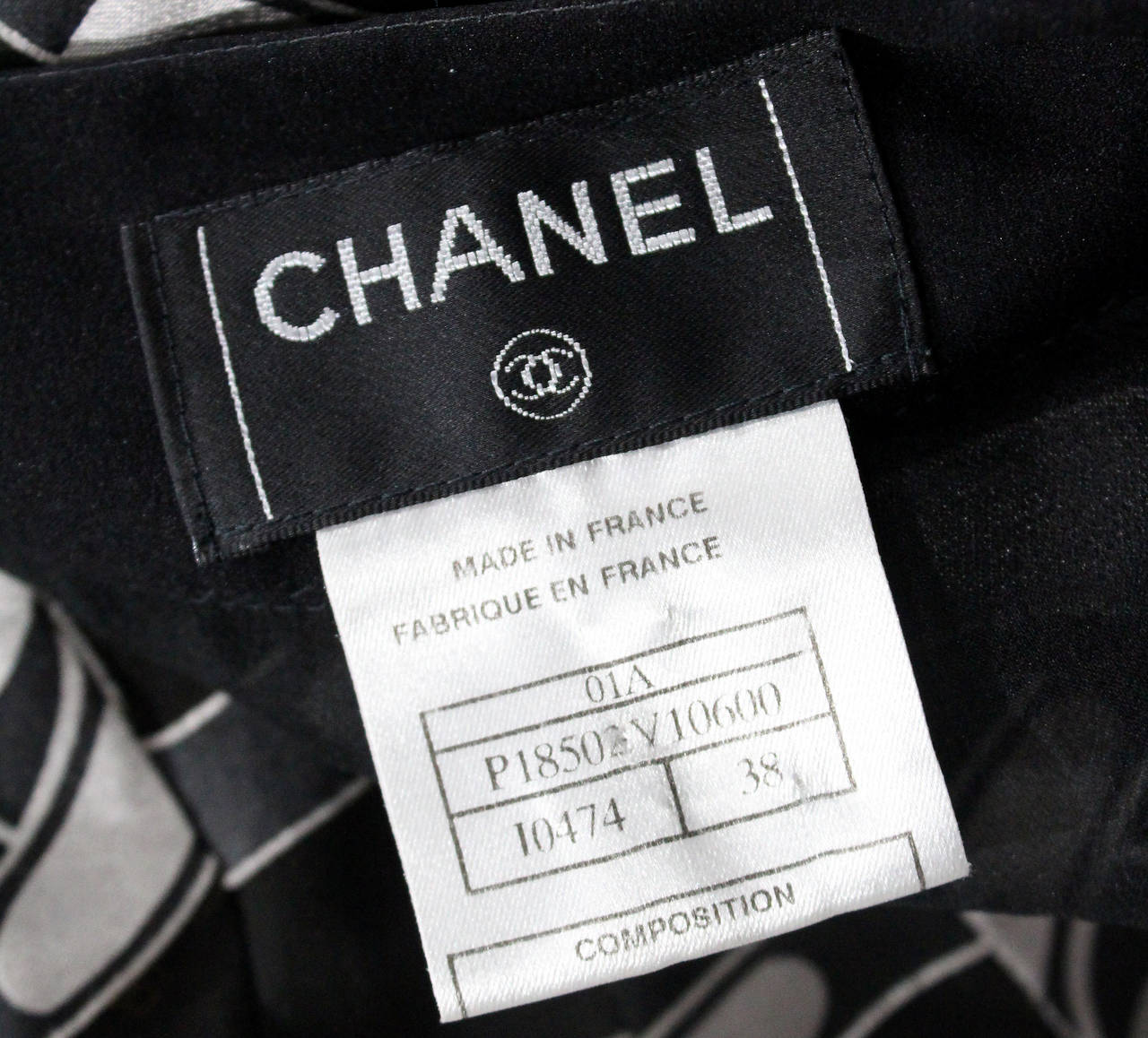 Black Chanel pleated silk chiffon mini skirt with chain print c. 2001