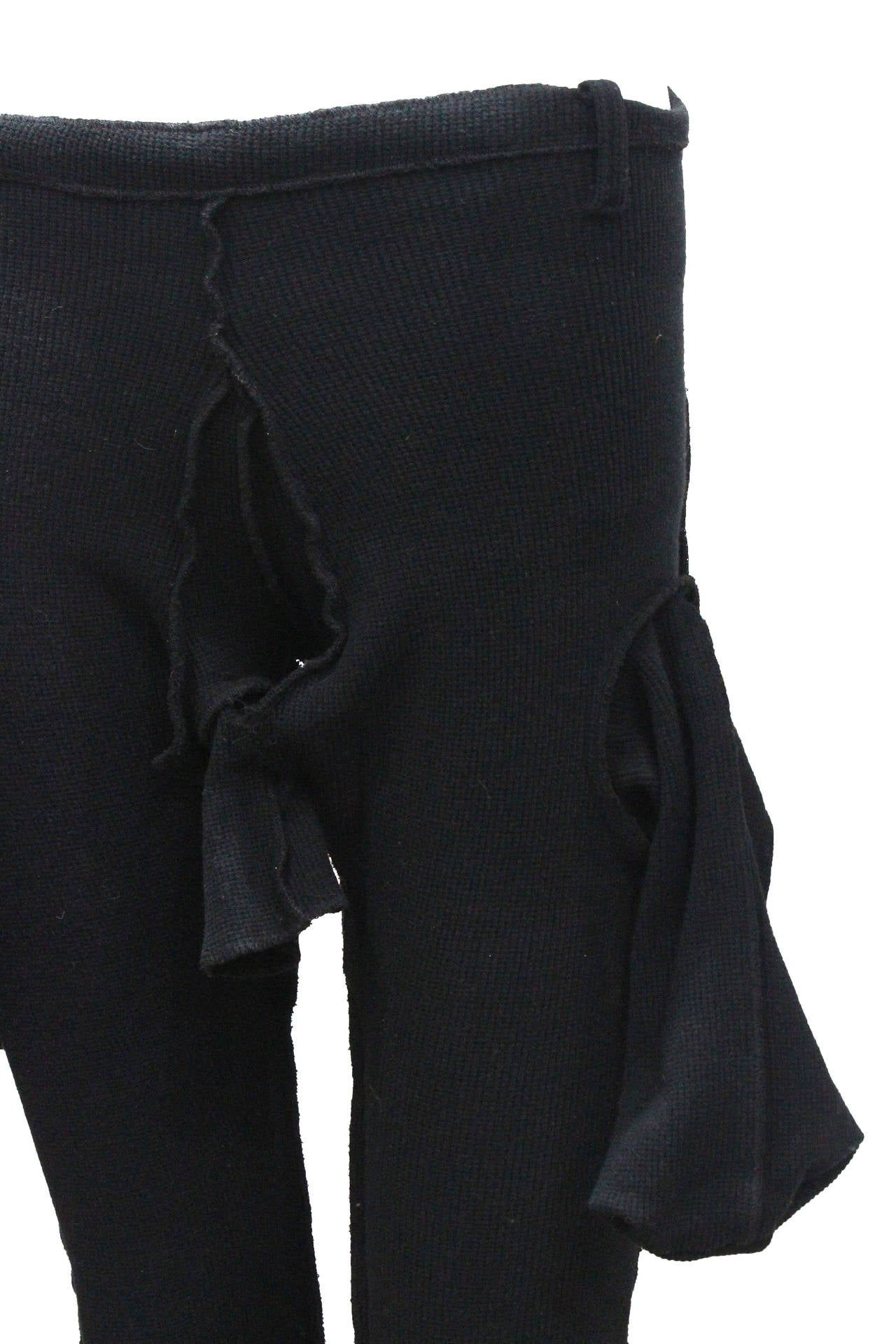 A fine and rare knitted pair of penis pants by artist and designer Christopher Nemeth. The pants are designed with a deconstructed aesthetic with frayed and raw edges, pockets turned inside out hang loosely all the way round and one acting as an