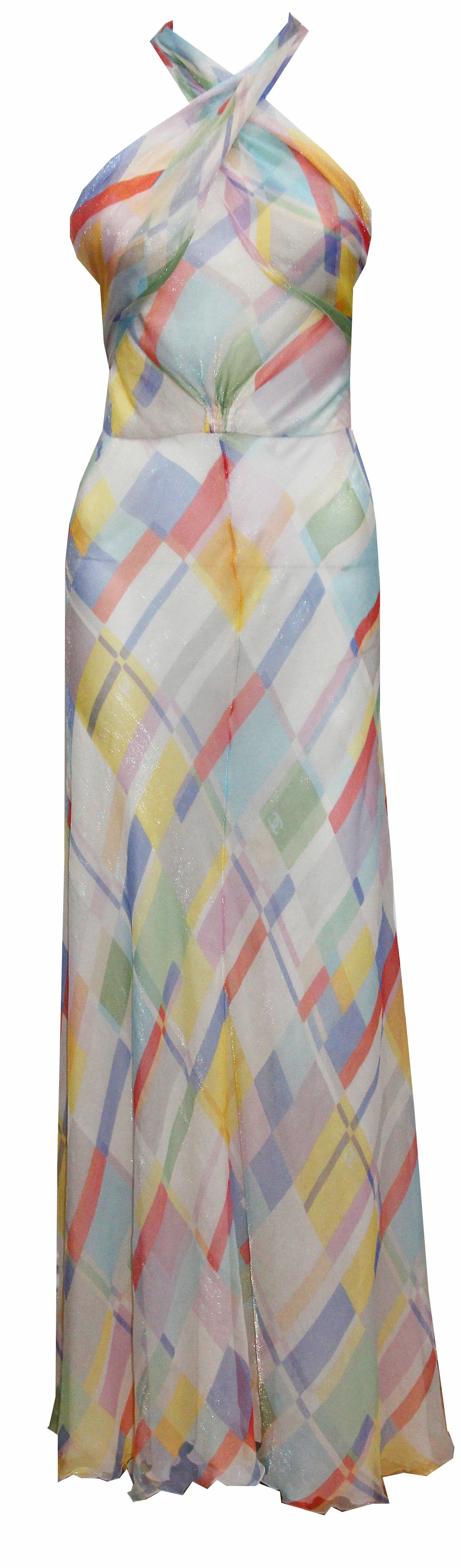 A beautiful silk chiffon scarf dress by the house of Chanel designed by Karl Lagerfeld in 1999. The dress is a pastel palette print with 'cc' logos appear throughout the print. The dress is very 30s inspired and has 2 very long scarfs attached to