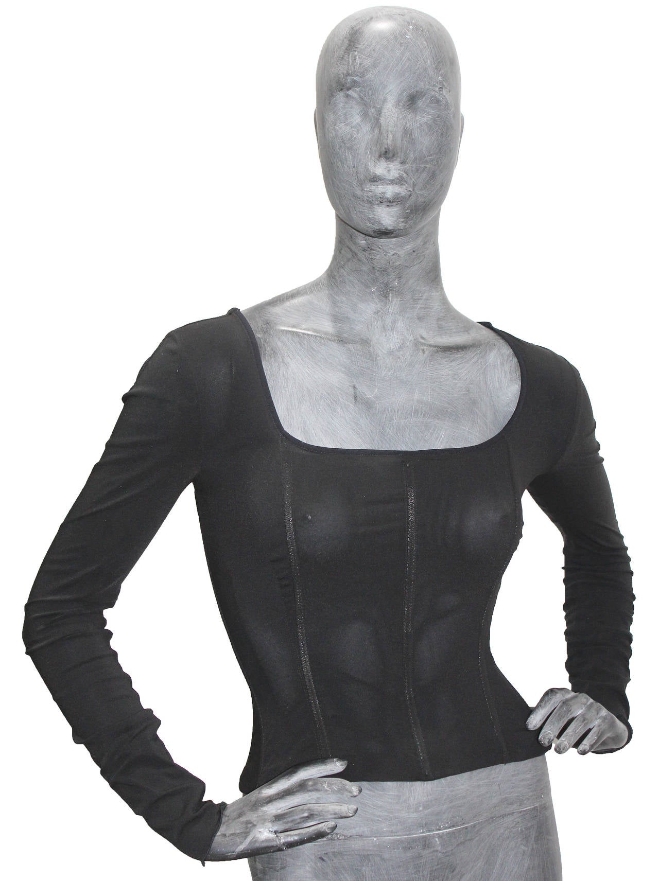 A black form fitting sweater with boned corset by Dolce & Gabbana from the 1980s.

Sizing: Italian - 42 / EU 38 / UK 10 / US 6