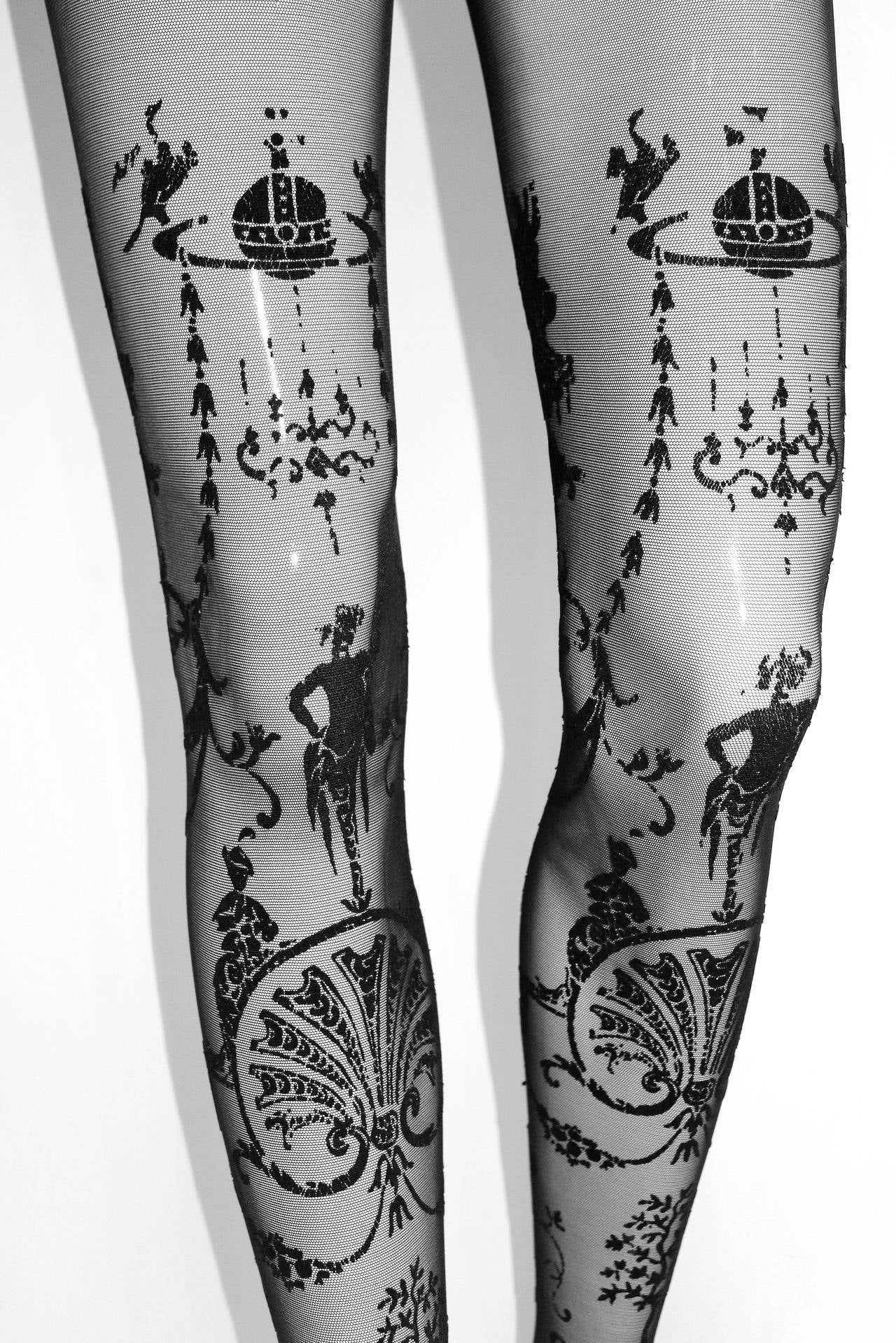 These sheer pantyhose are from the iconic Vivienne Westwood 'Portrait Collection' designed in 1990. They feature swirling rococo inspired print in black velvet. 

Sizing: Would fit anyone between an XS - M