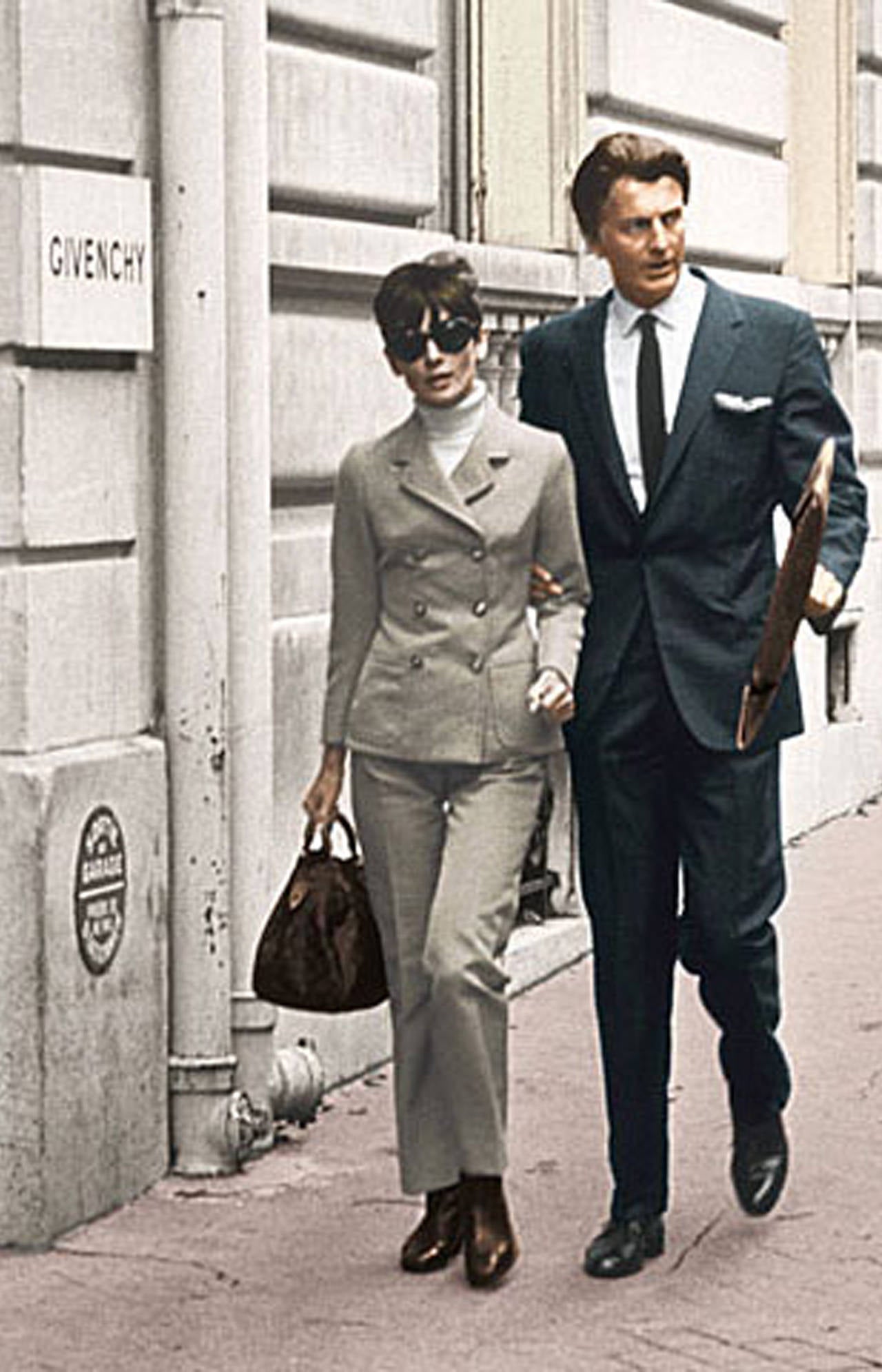 A brilliant late 60s Givenchy corduroy trouser suit. The suit includes a high standing collared jacket with cinched in waist and high waisted cropped flared pants. Audrey Hepburn wore a lot of Givenchy's trouser suit during this period and was one