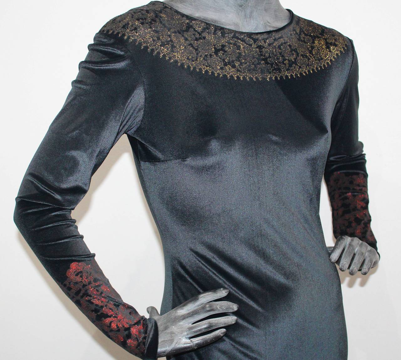 This dress comes from the famous A/W 1990 'Portrait' Collection. This full length body con dress is made of black velvet with decorative glitter.

Size '2'